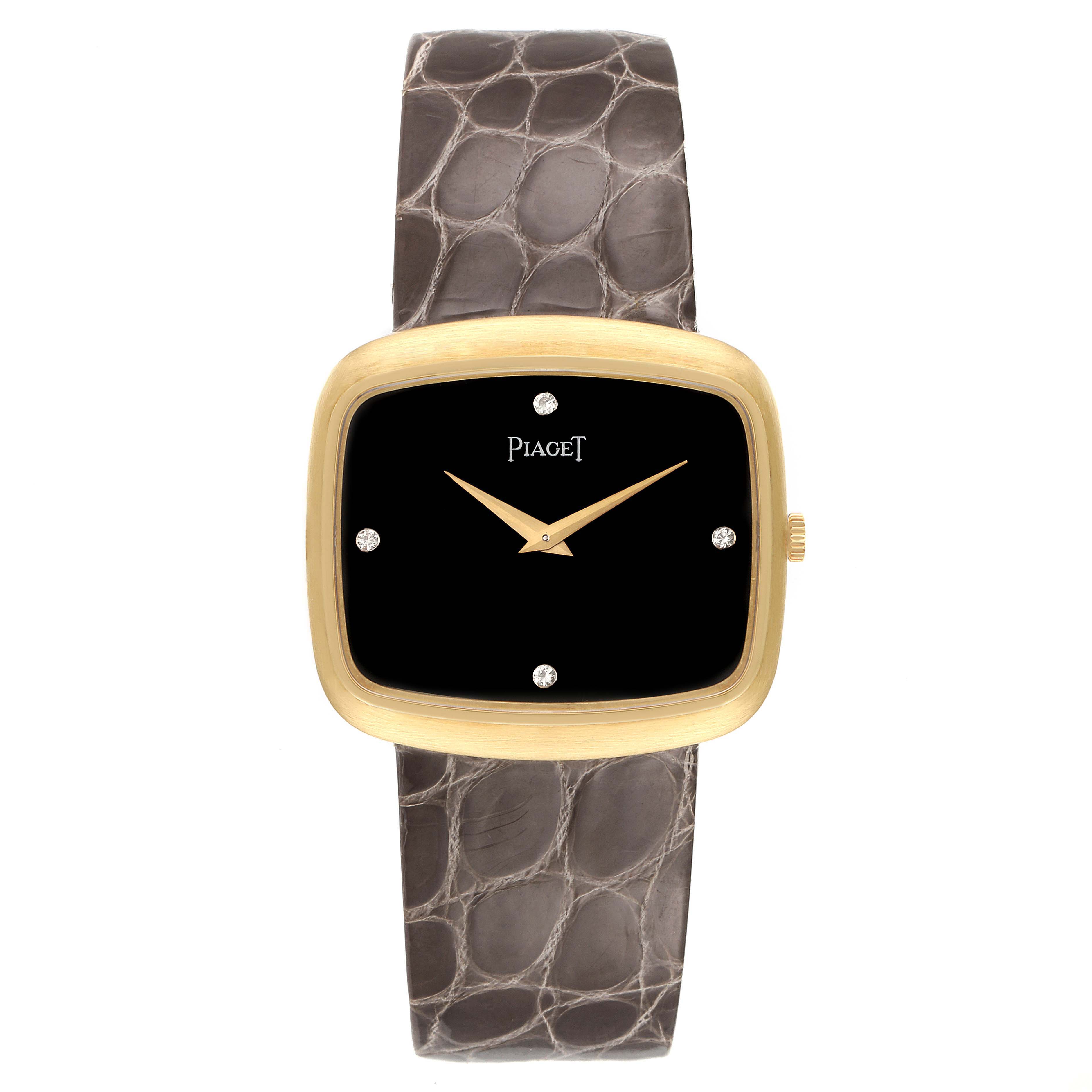 The image shows a frontal view of the Piaget 9751 Men's Yellow Gold Black Dial 9751 Men's Yellow Gold Black Dial 9751 model, featuring its black diamond dial, 18K yellow gold case, and grey strap.