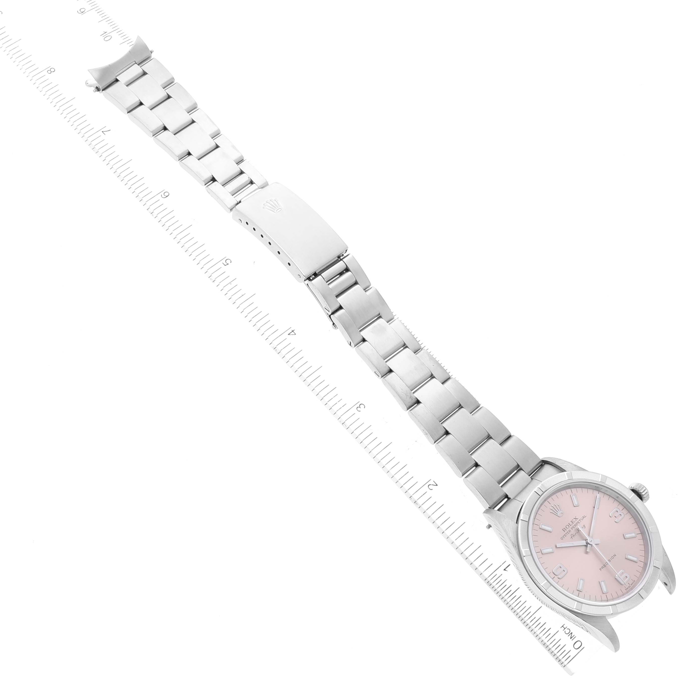 This image shows the Rolex Air-King 14010 Men's Stainless Steel Pink Dial 14010 Men's Stainless Steel Pink Dial watch laid flat with both the face and bracelet visible, alongside a measuring ruler.