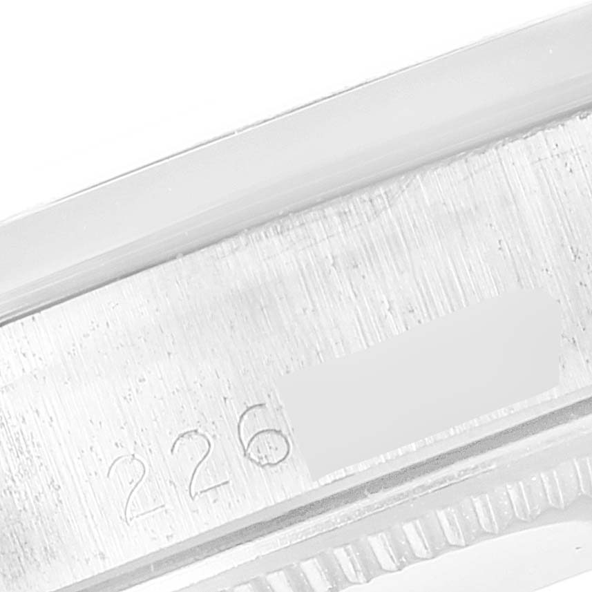 This close-up image shows the engraved serial number area on the case side of the Rolex Vintage Collection 5500 Men
s Stainless Steel Silver Dial 5500 Men
s Stainless Steel Silver Dial model.