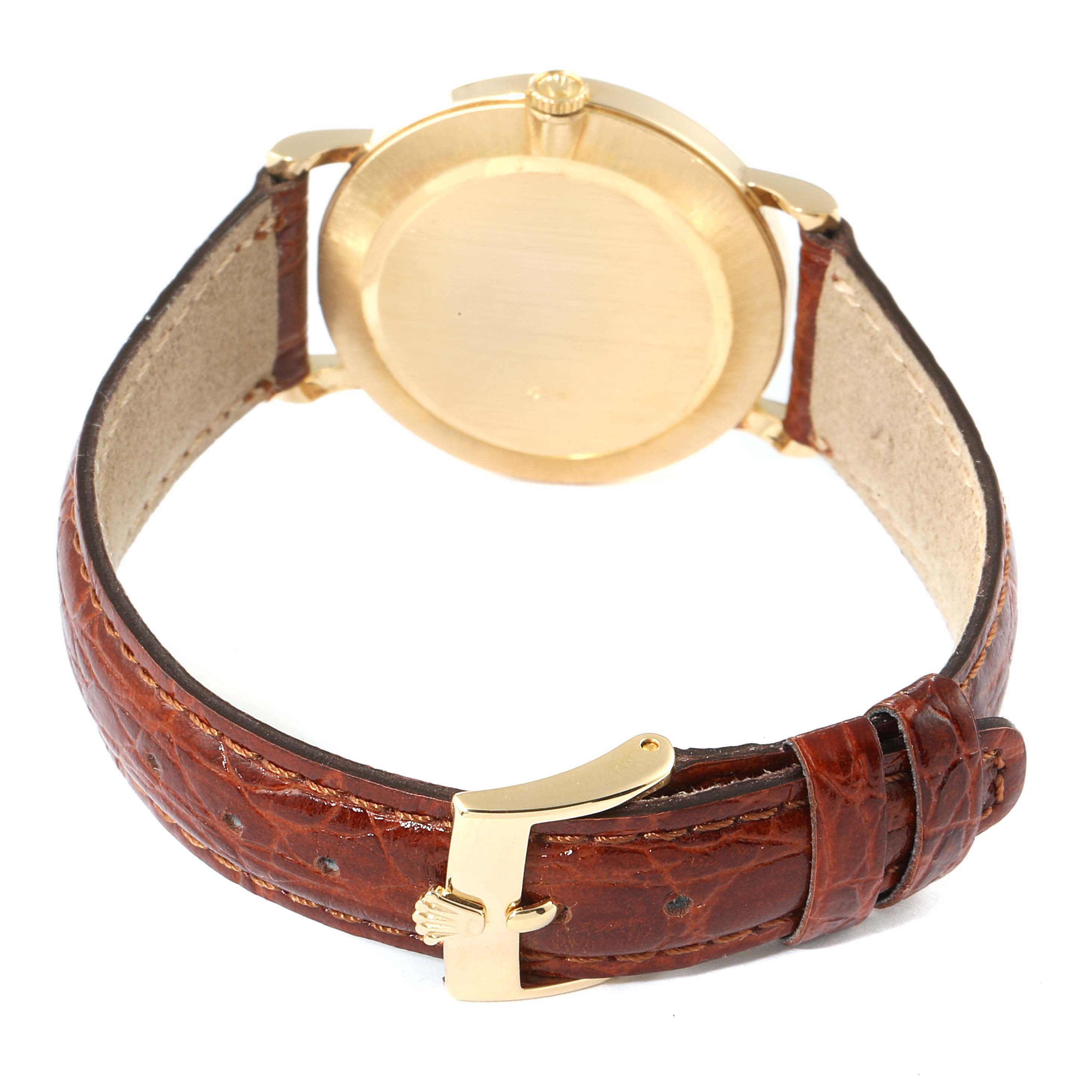 This image shows the back and side of a Rolex Cellini 5112 Men's Yellow Gold Champagne Dial 5112 Men's Yellow Gold Champagne Dial watch, featuring a leather strap and a gold buckle.