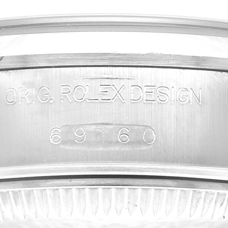 The image shows a close-up of the case side engraving of a Rolex Date 69160 Women's Stainless Steel Blue Dial 69160 Women's Stainless Steel Blue Dial model, highlighting its original Rolex design and model number 69760.