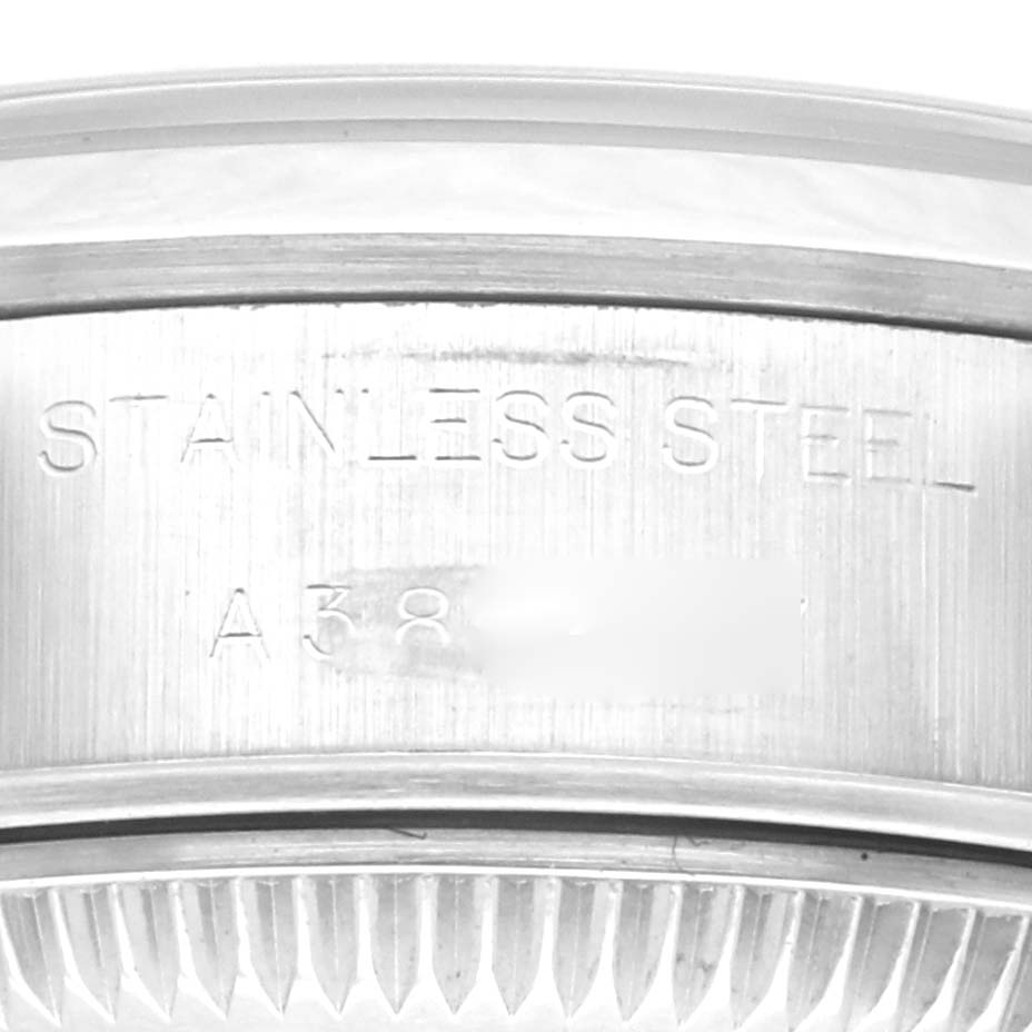 Close-up of the serial number and "Stainless Steel" engraving on the Rolex Date 69160 Women's Stainless Steel Blue Dial 69160 Women's Stainless Steel Blue Dial model watch case.