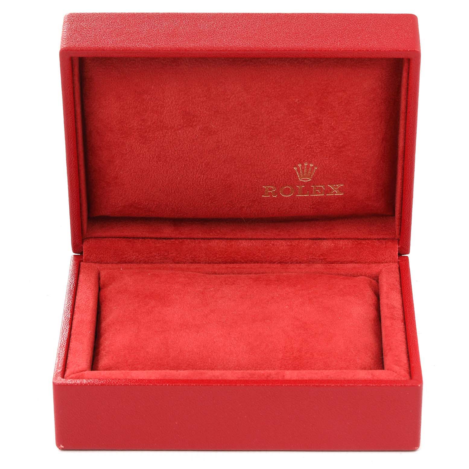 The image shows an open red Rolex Date 79190 Women's Stainless Steel White Dial 79190 Women's Stainless Steel White Dial model watch box, displaying the cushioned interior.