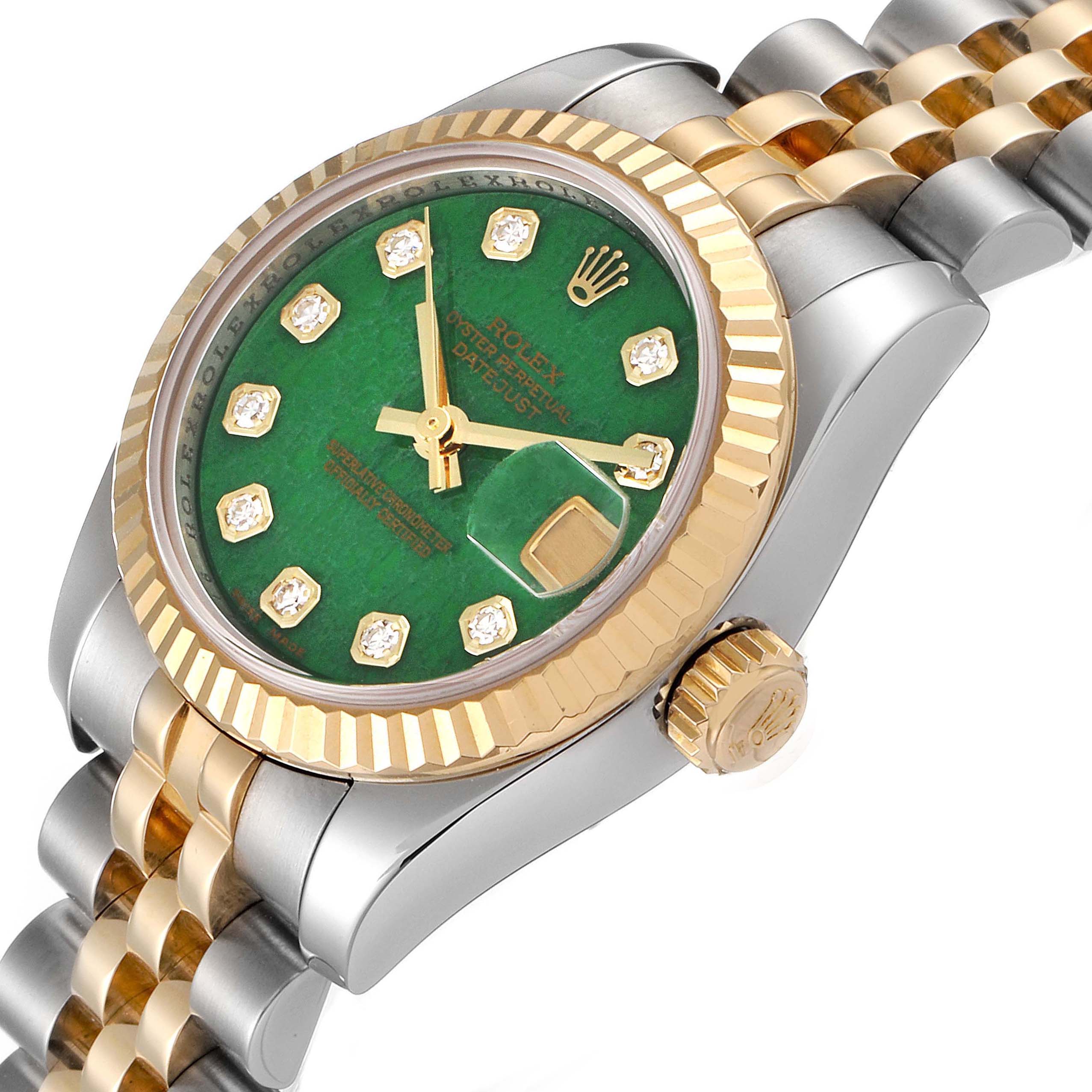 This image shows a close-up angle of the Rolex Datejust 179173 Women's Steel and Gold (two tone) Green Dial 179173 Women's Steel and Gold (two tone) Green Dial watch, highlighting its green dial, gold bezel, and two-tone bracelet.