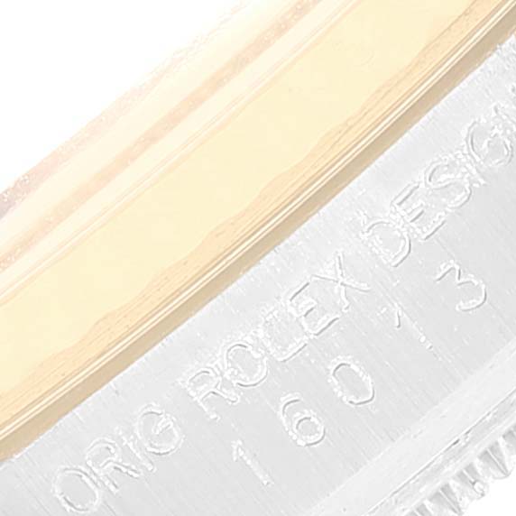 The image shows a close-up of the Rolex Datejust 16013 Men
s Steel and Gold (two tone) Champagne Dial 16013 Men
s Steel and Gold (two tone) Champagne Dial model
s case, highlighting the engraved text and part of the bezel.