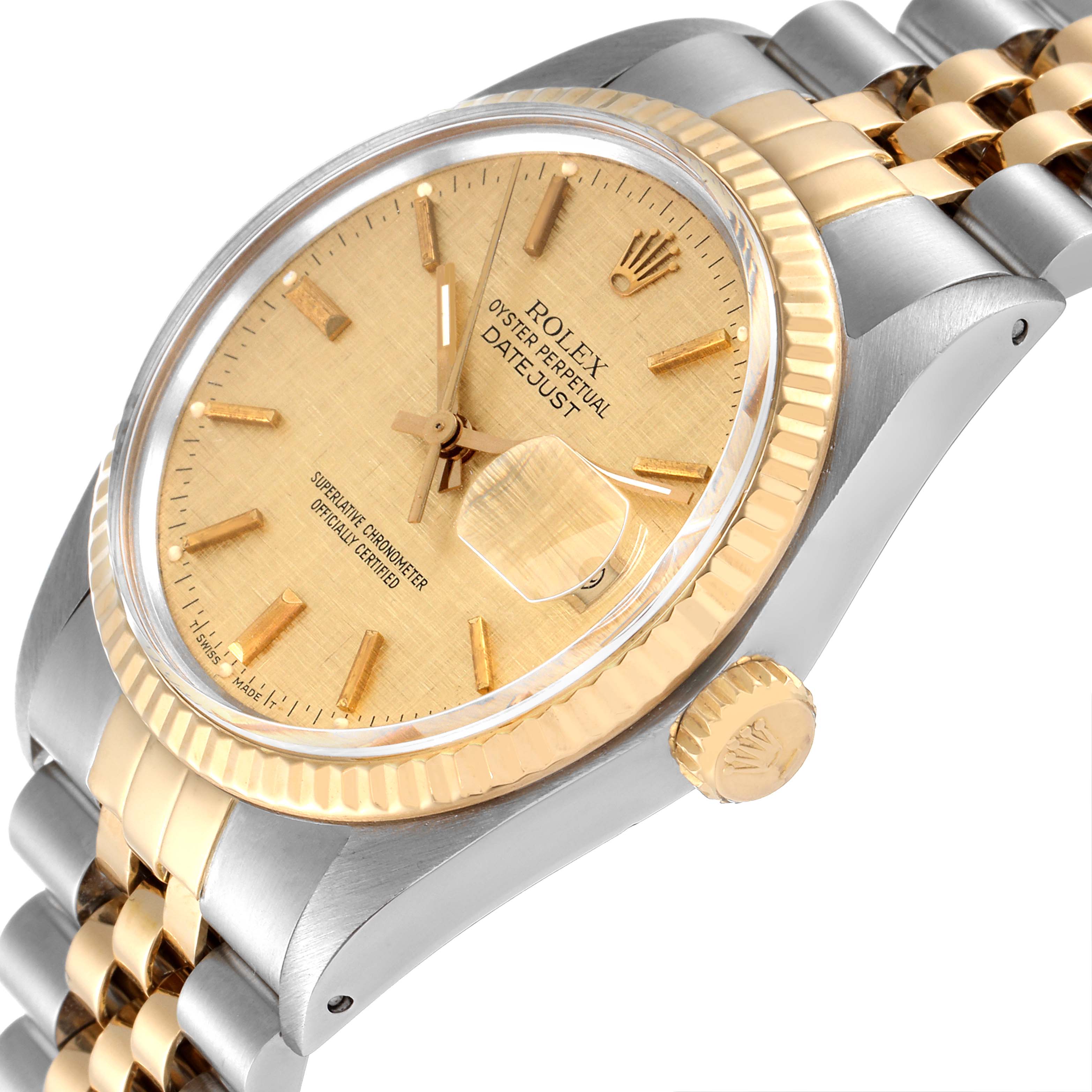 This image shows a Rolex Datejust 16013 Men
s Steel and Gold (two tone) Champagne Dial 16013 Men
s Steel and Gold (two tone) Champagne Dial watch from an angled view, highlighting the gold bezel, dial, crown, and two-tone bracelet.