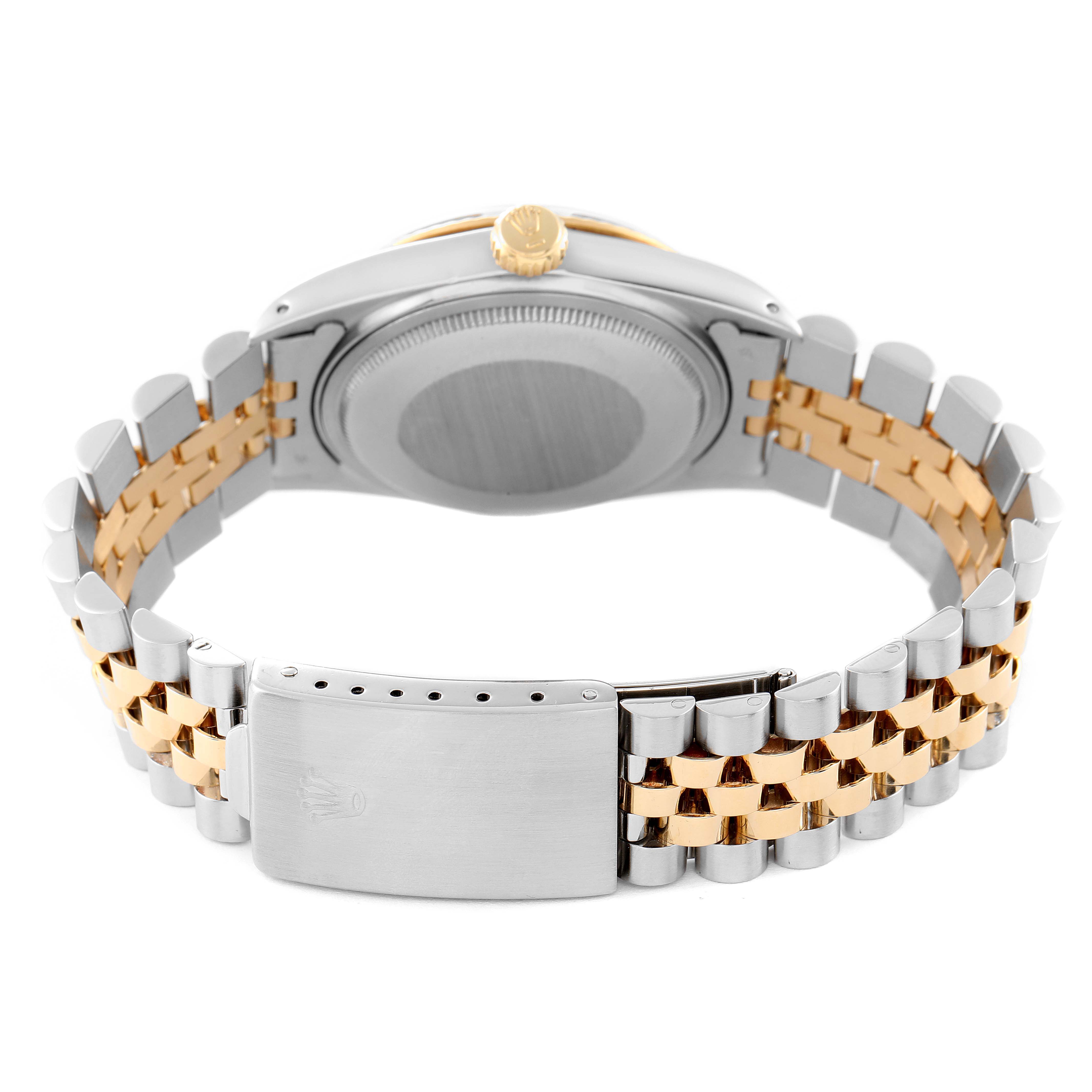 The image shows the back and band of the Rolex Datejust 16013 Men
s Steel and Gold (two tone) Champagne Dial 16013 Men
s Steel and Gold (two tone) Champagne Dial model watch, highlighting its two-tone metal bracelet and clasp.