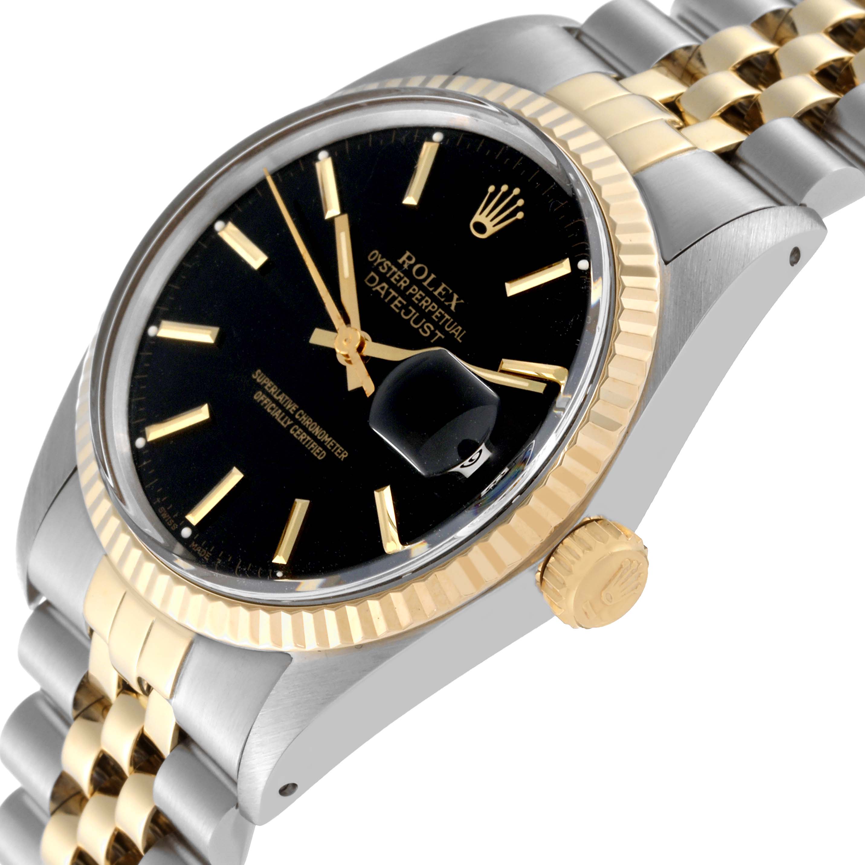 The image shows a close-up of the Rolex Datejust 16013 Men's Steel and Gold (two tone) Black Dial 16013 Men's Steel and Gold (two tone) Black Dial watch at an oblique angle, highlighting the bezel, dial, crown, and part of the bracelet.