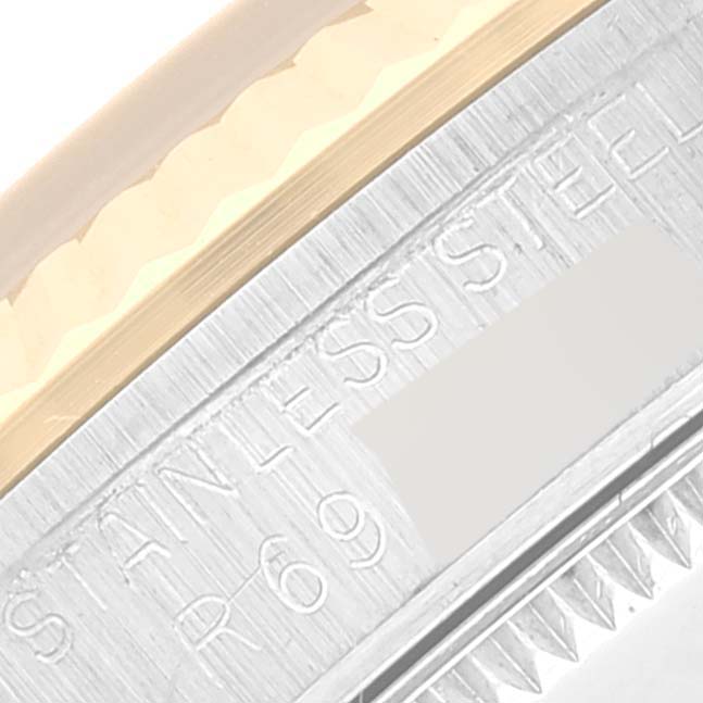 This image shows a close-up of the side engraving on a mid-size Rolex watch, highlighting the stainless steel material.