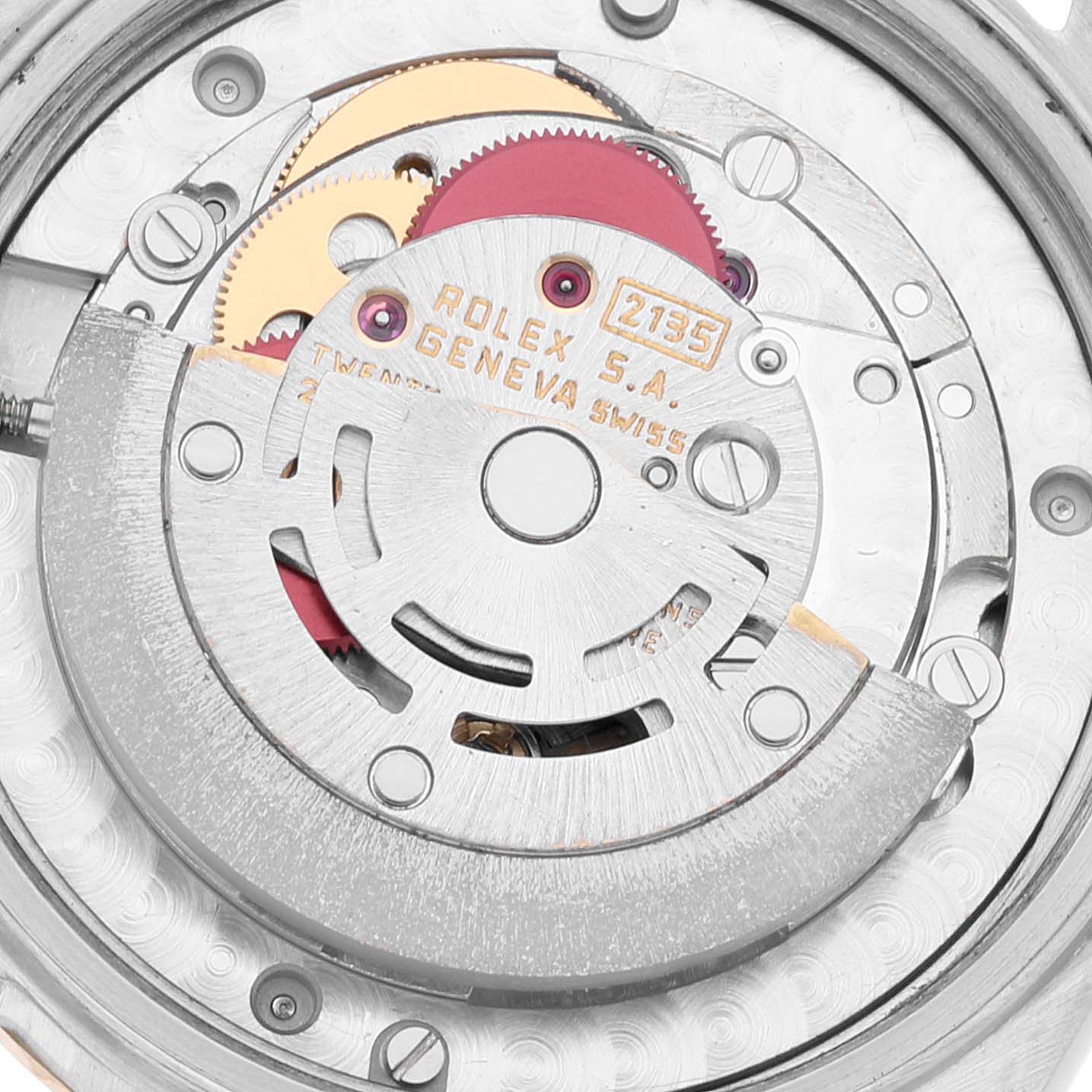 The image shows a close-up, top-down view of the inner mechanical movement of a mid-size Rolex watch model 2135.