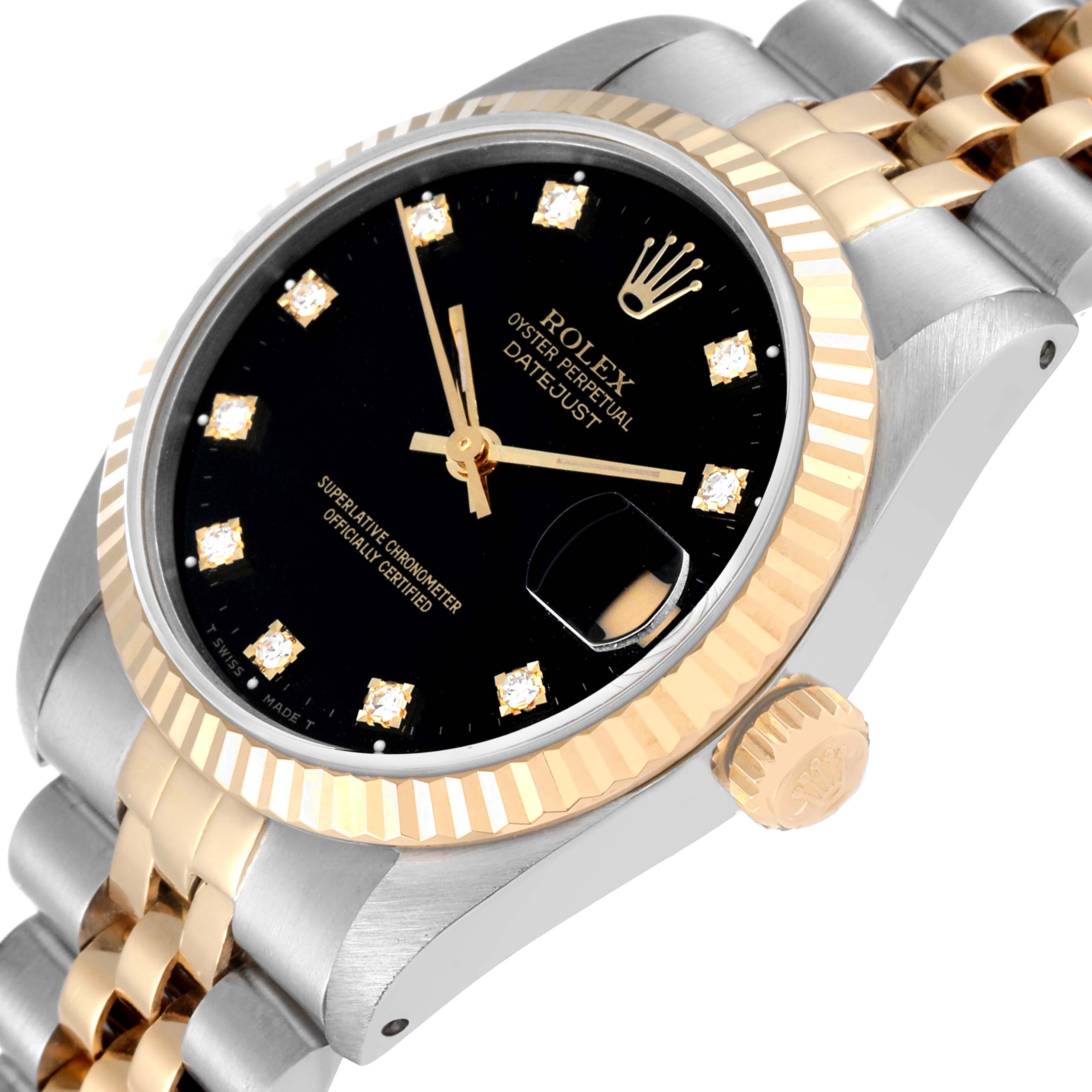 This image shows the dial, crown, and bracelet of a Rolex Mid-Size 68273 Women's Steel and Gold (two tone) Black Dial 68273 Women's Steel and Gold (two tone) Black Dial Datejust watch at a slightly tilted angle.