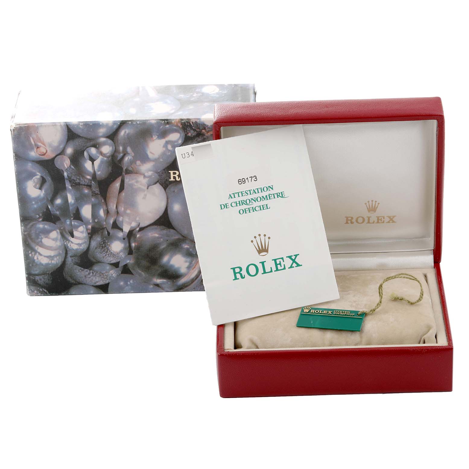 This image shows a Rolex Datejust 69173 Women's Steel and Gold (two tone) Mother of Pearl Dial 69173 Women's Steel and Gold (two tone) Mother of Pearl Dial watch box, the official chronometer certification, and a hang tag placed inside.