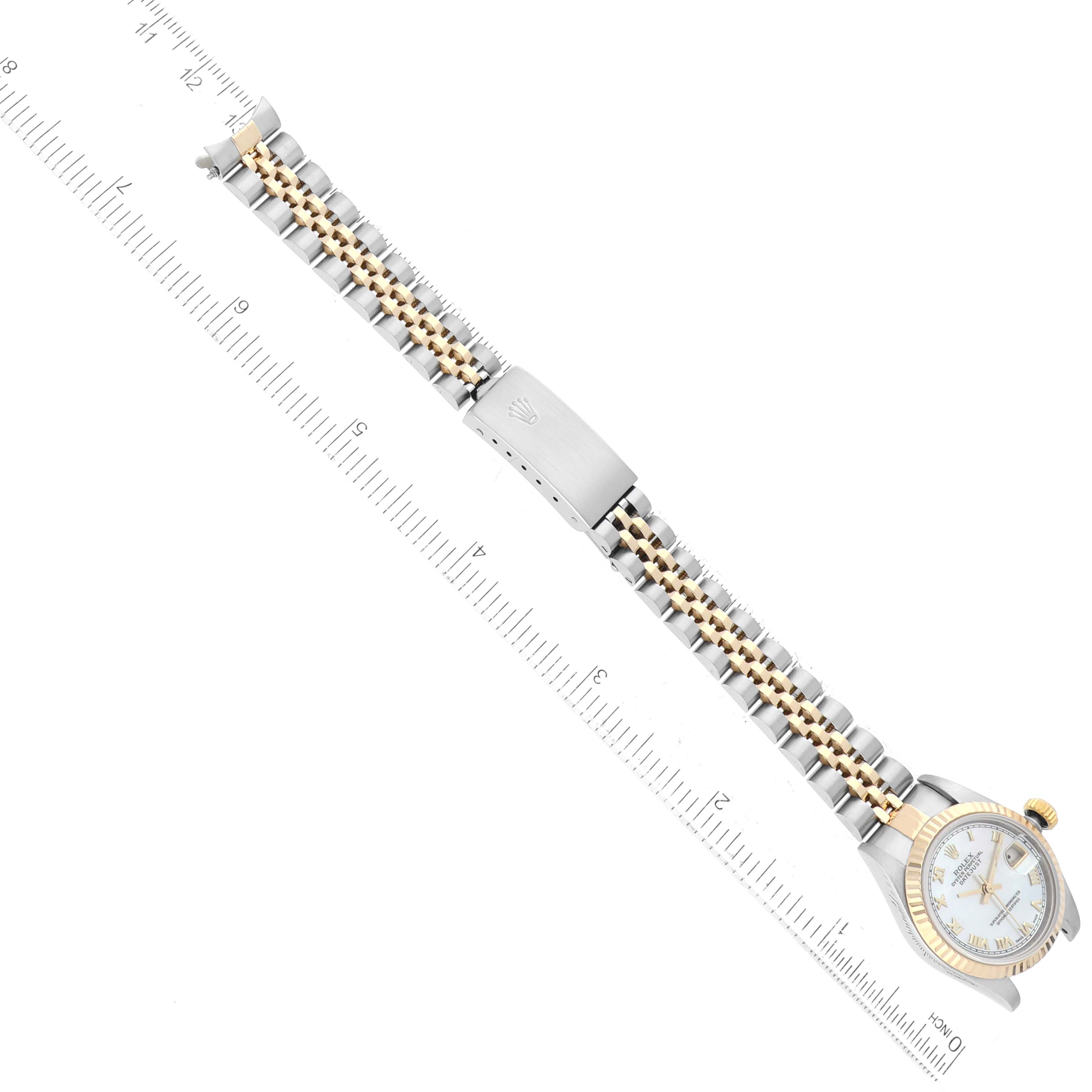 The image shows the entire Rolex Datejust 69173 Women's Steel and Gold (two tone) Mother of Pearl Dial 69173 Women's Steel and Gold (two tone) Mother of Pearl Dial watch laid flat with a ruler for scale, highlighting the bracelet, clasp, and watch face.