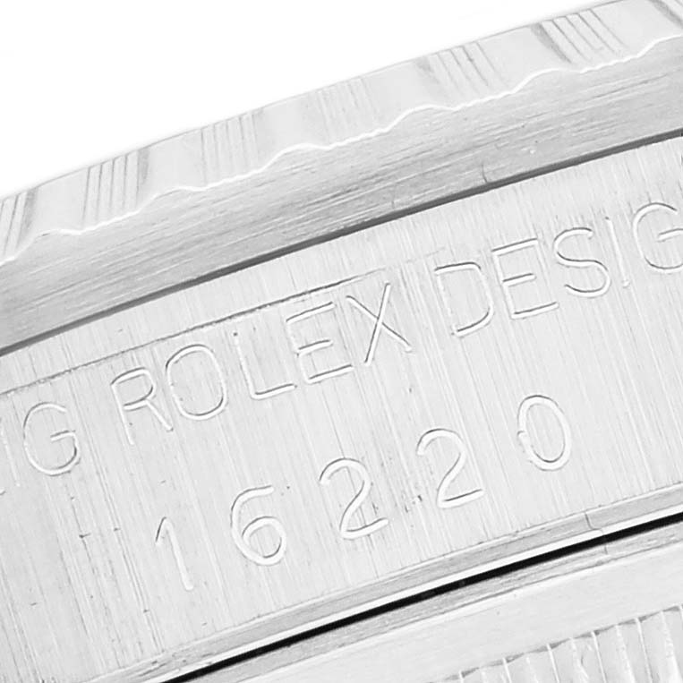 This close-up image shows the engraved model number and part of the bezel of a Rolex Datejust 16220 Men's Stainless Steel Silver Dial 16220 Men's Stainless Steel Silver Dial.