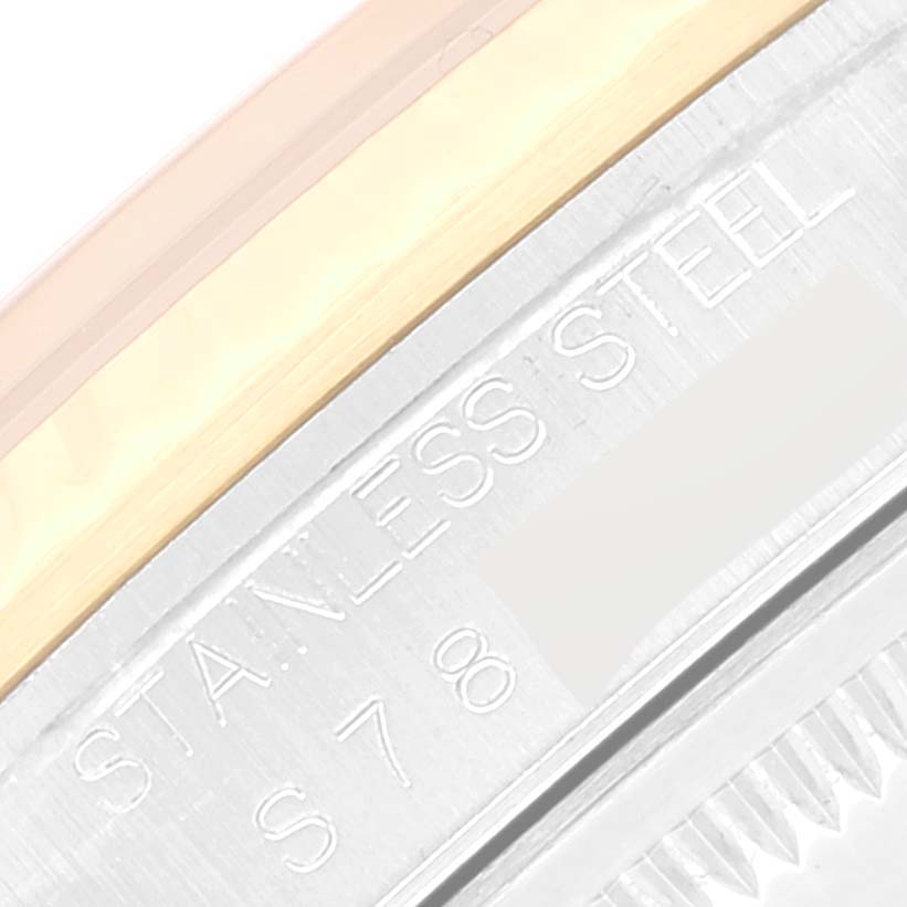 This image shows a close-up of the outer edge and engraving on the casing of a Rolex Datejust 16233 Men's Steel and Gold (two tone) White Dial 16233 Men's Steel and Gold (two tone) White Dial watch.