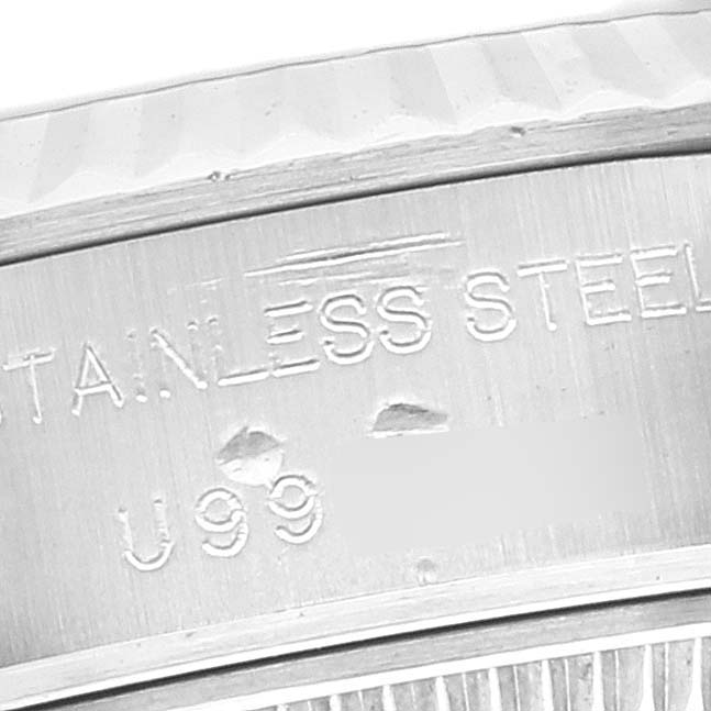 Close-up of the side engraving on the case of a Rolex Datejust 69174 Women's Stainless Steel Black Dial 69174 Women's Stainless Steel Black Dial mentioning "STAINLESS STEEL" and partial numbers.