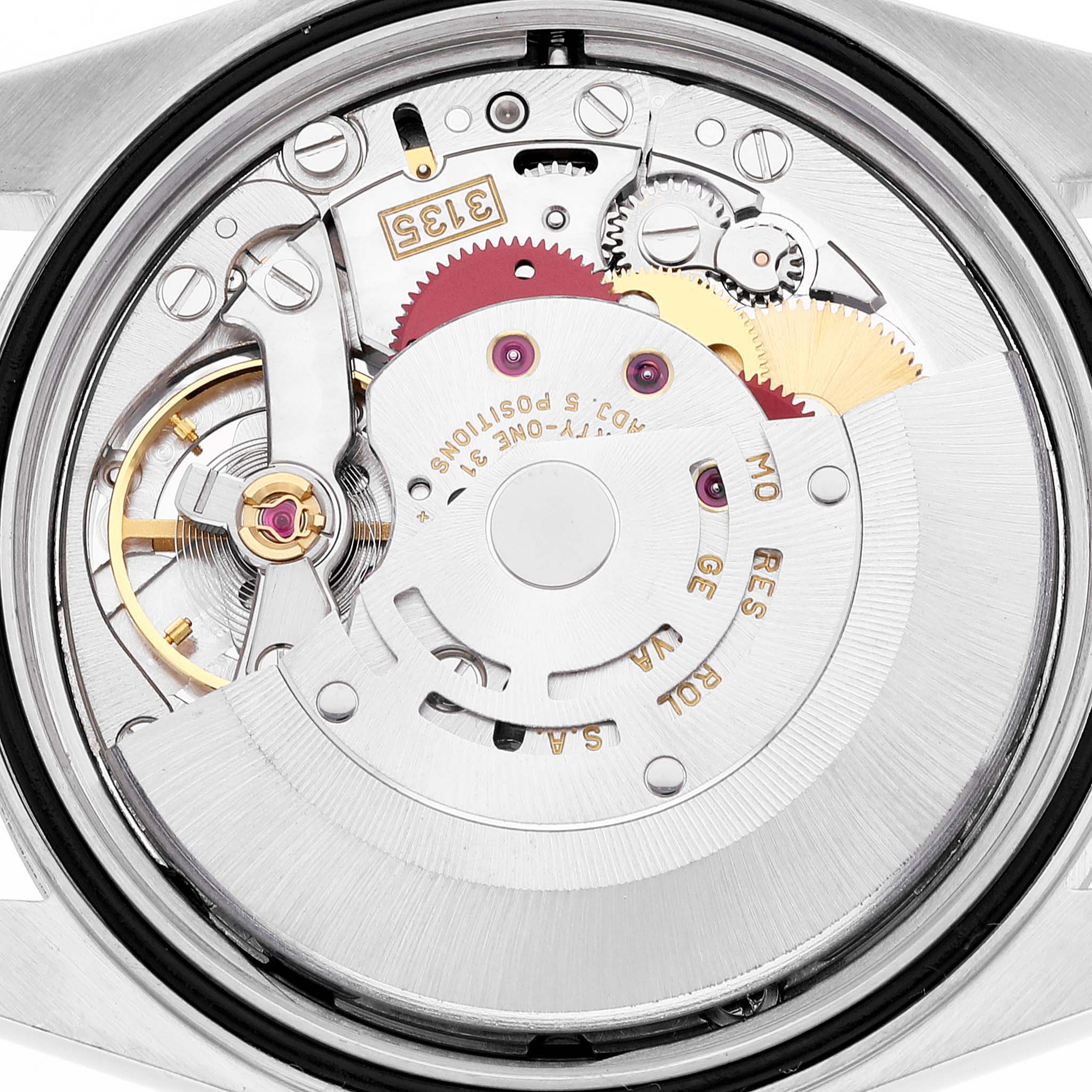 The image shows a top view of the Rolex Datejust 16234 Men's Stainless Steel Blue Dial 16234 Men's Stainless Steel Blue Dial watch's movement mechanism, highlighting gears and components.