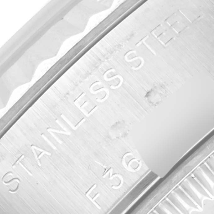 The image shows a close-up of the stainless steel case back of a Rolex Datejust 79174 Women's Steel and Gold (two tone) Mother of Pearl Dial 79174 Women's Steel and Gold (two tone) Mother of Pearl Dial watch.