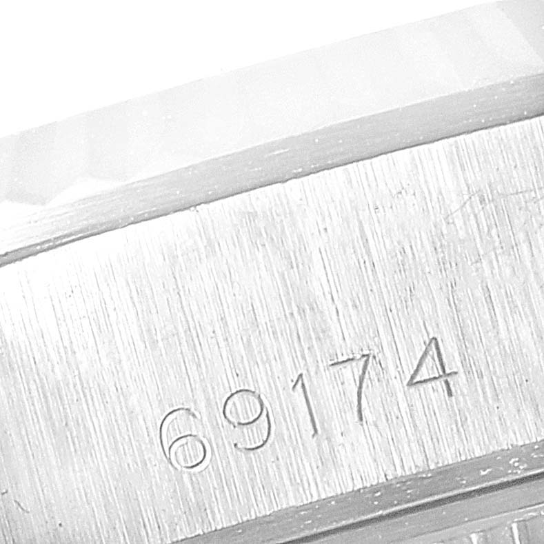 The image shows a close-up of the model number "69174" engraved on the case of a Rolex Datejust 79174 Women's Stainless Steel Pink Dial 79174 Women's Stainless Steel Pink Dial watch.