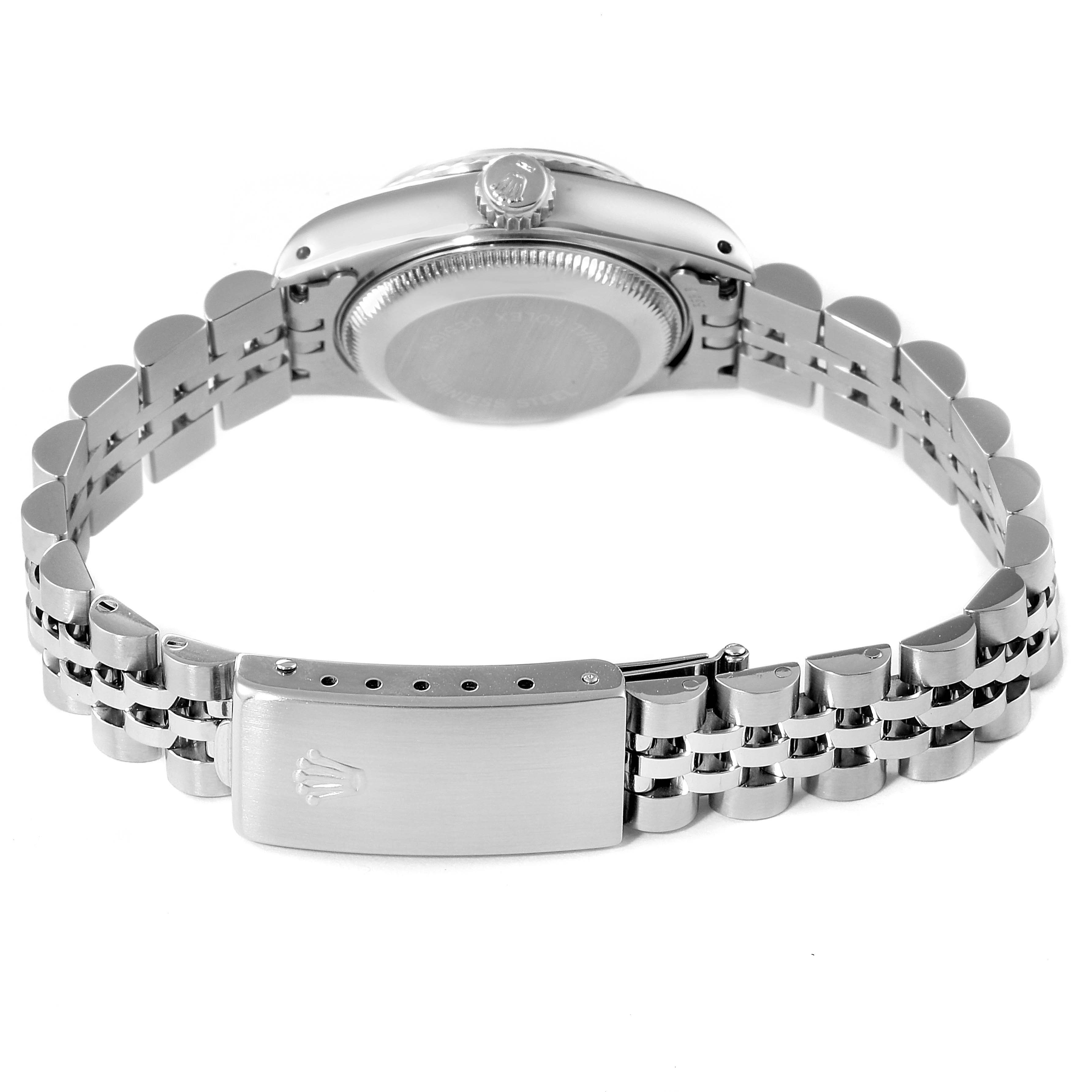 This image shows the back of a Rolex Datejust 79174 Women's Stainless Steel Pink Dial 79174 Women's Stainless Steel Pink Dial watch and its bracelet clasp.