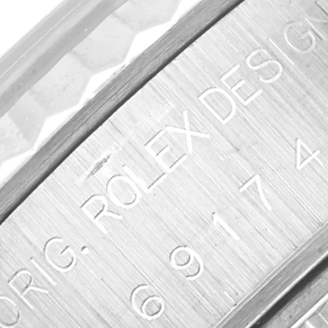 The image shows a close-up of the case engraving on a Rolex Datejust 69174 Women's Stainless Steel Silver Dial 69174 Women's Stainless Steel Silver Dial watch.