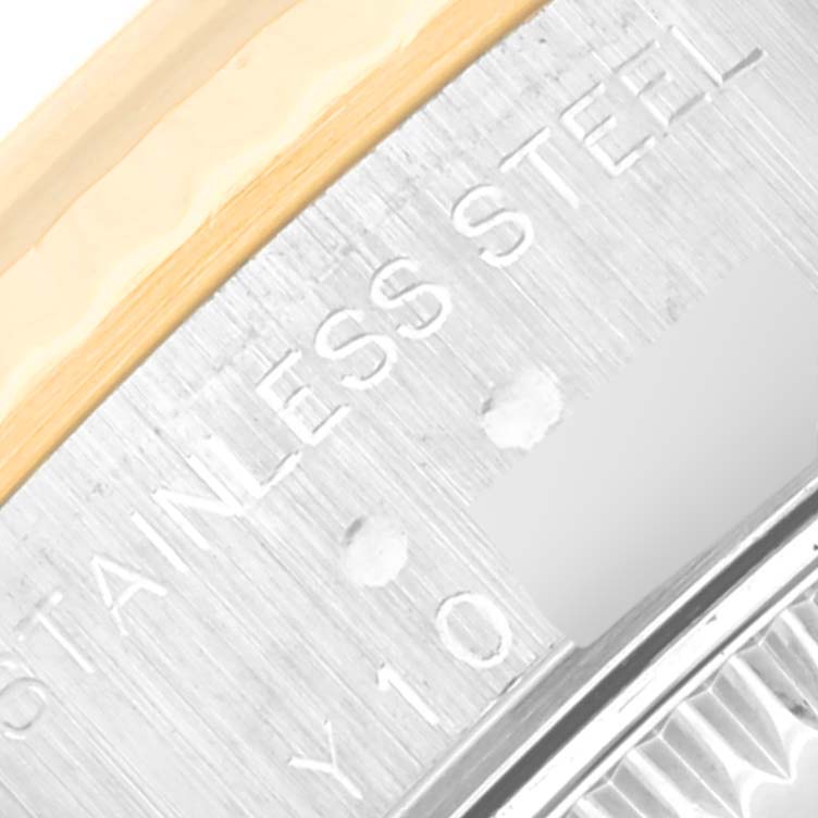 The image shows a close-up of the engraved text and part of the bezel on the Rolex Datejust 79173 Women's Steel and Gold (two tone) Black Dial 79173 Women's Steel and Gold (two tone) Black Dial watch.