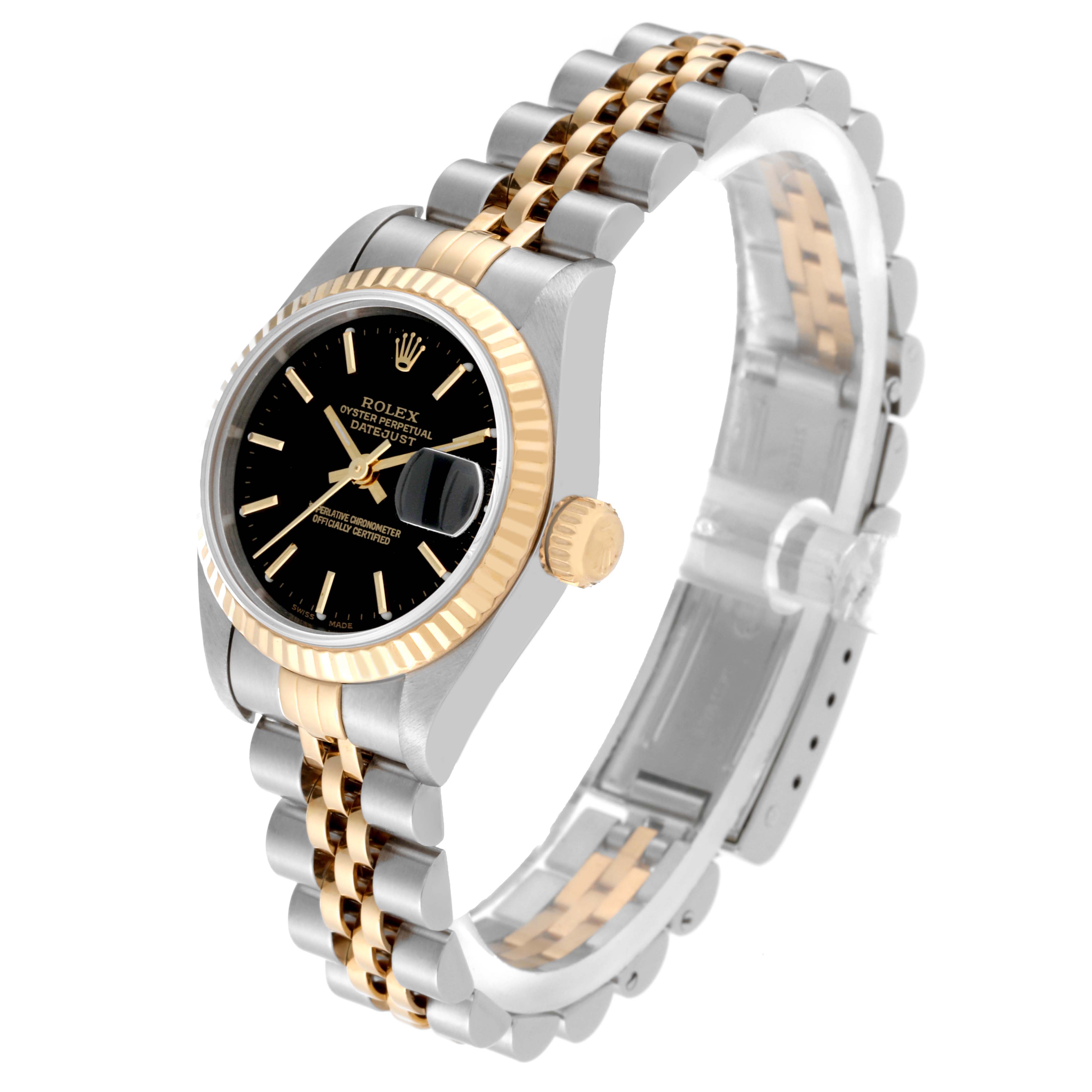 The Rolex Datejust 79173 Women's Steel and Gold (two tone) Black Dial 79173 Women's Steel and Gold (two tone) Black Dial watch is shown at a three-quarter angle, highlighting its two-tone bracelet, black dial, and fluted bezel.