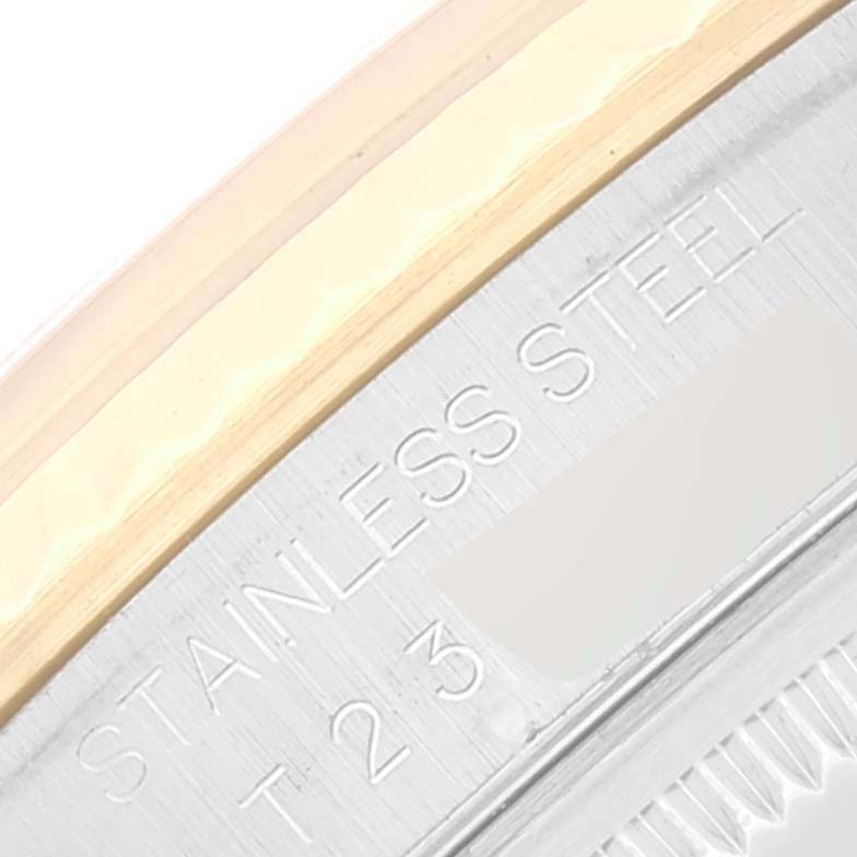 This close-up image shows part of the bezel and the "STAINLESS STEEL" engraving on a Rolex Datejust 16233 Men's Steel and Gold (two tone) Black Dial 16233 Men's Steel and Gold (two tone) Black Dial watch.