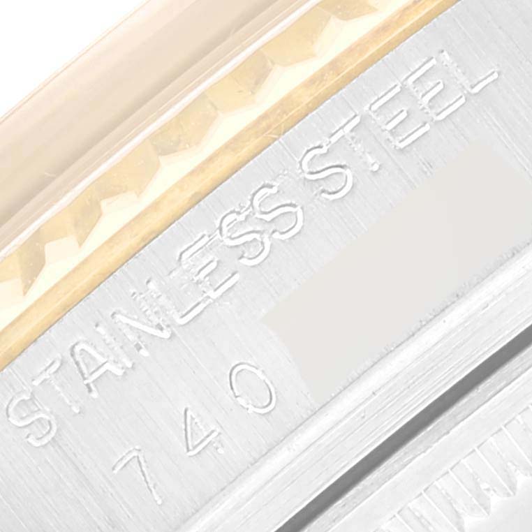 The image shows a close-up of the side of a Rolex Datejust 16013 Men's Steel and Gold (two tone) Champagne Dial 16013 Men's Steel and Gold (two tone) Champagne Dial watch, highlighting the "STAINLESS STEEL" engraving.