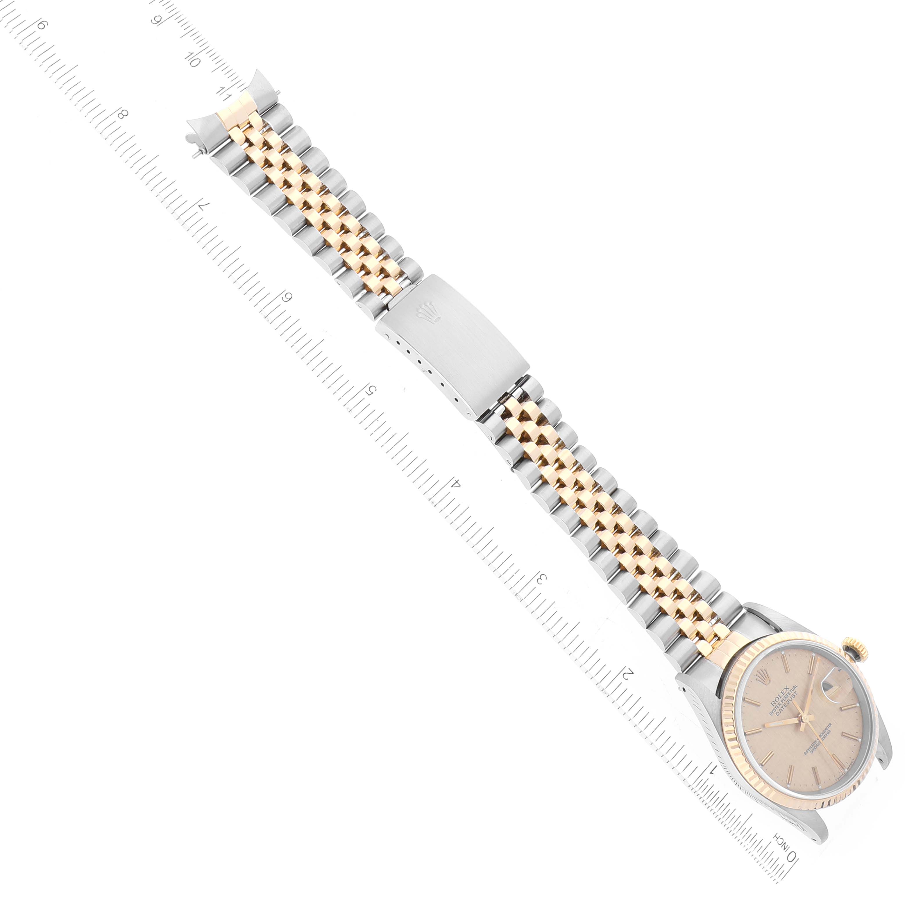 This image shows the Rolex Datejust 16233 Men's Steel and Gold (two tone) Champagne Dial 16233 Men's Steel and Gold (two tone) Champagne Dial watch at a diagonal angle, highlighting the face, bezel, bracelet, and clasp.