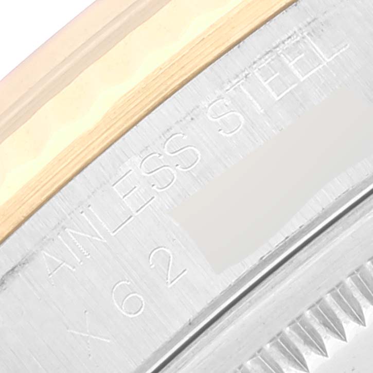 The image shows a close-up of the edge and bezel details of a Rolex Datejust 16233 Men's Steel and Gold (two tone) Champagne Dial 16233 Men's Steel and Gold (two tone) Champagne Dial watch, highlighting the stainless steel and engravings.