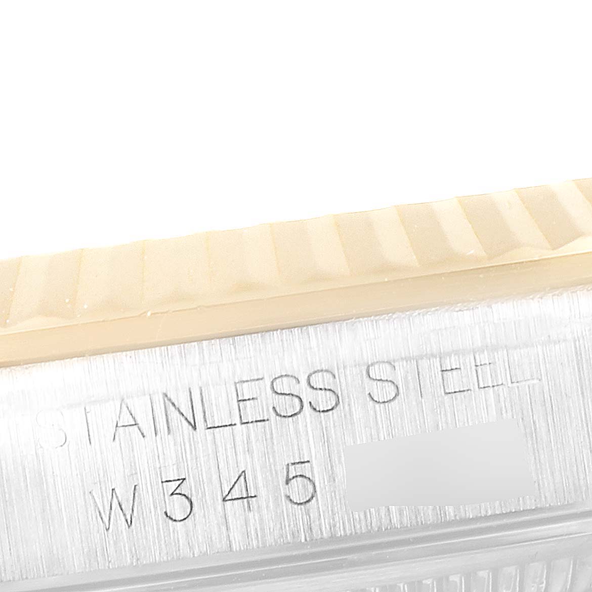 The image shows a close-up of the side of a Rolex Datejust 16233 Men's Steel and Gold (two tone) White Dial 16233 Men's Steel and Gold (two tone) White Dial watch, specifically highlighting the "Stainless Steel" engraving.