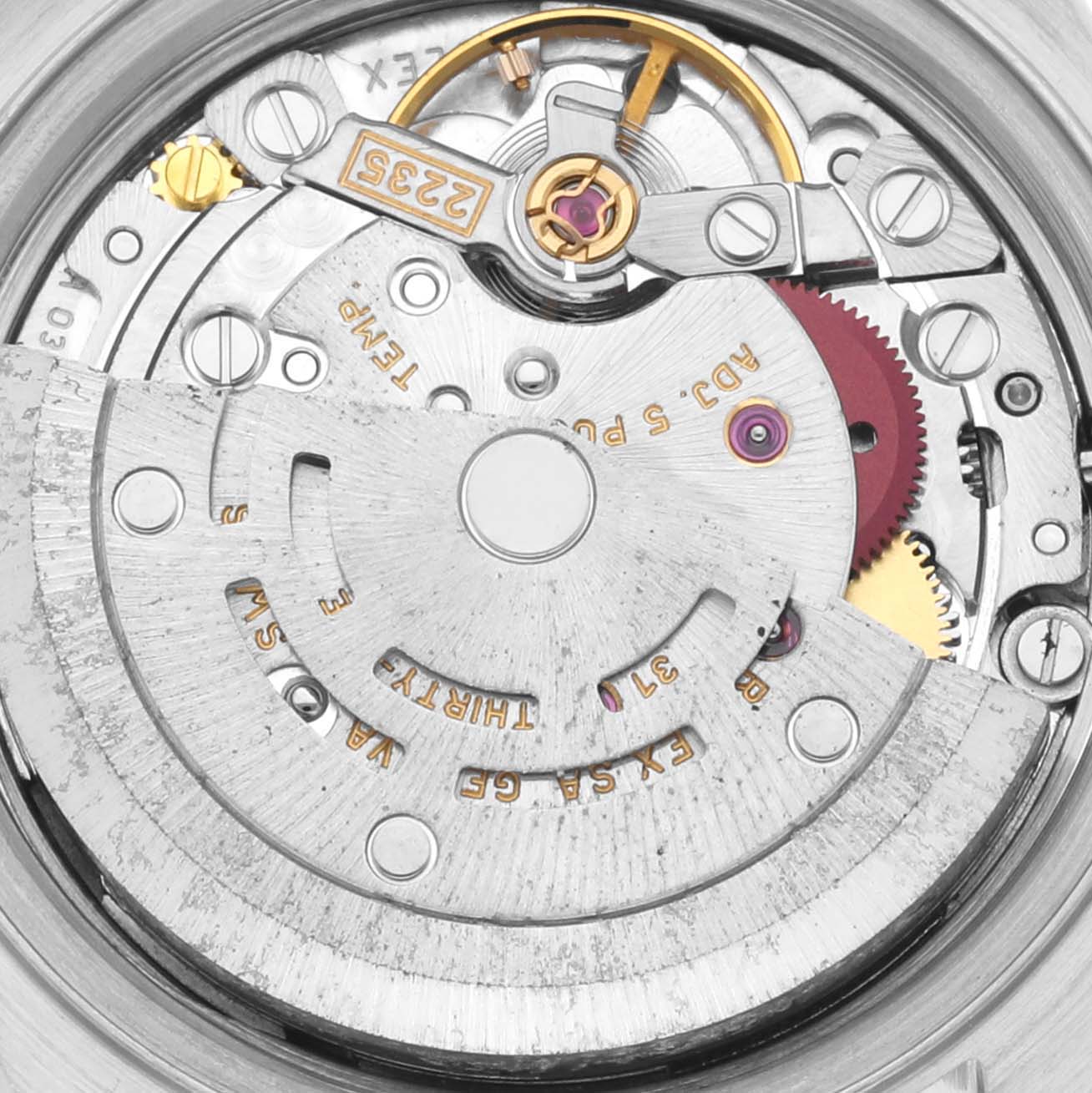 The image shows a close-up view of the Rolex Datejust 79173 Women's Steel and Gold (two tone) Blue Dial 79173 Women's Steel and Gold (two tone) Blue Dial movement, featuring gears and intricate mechanical parts.