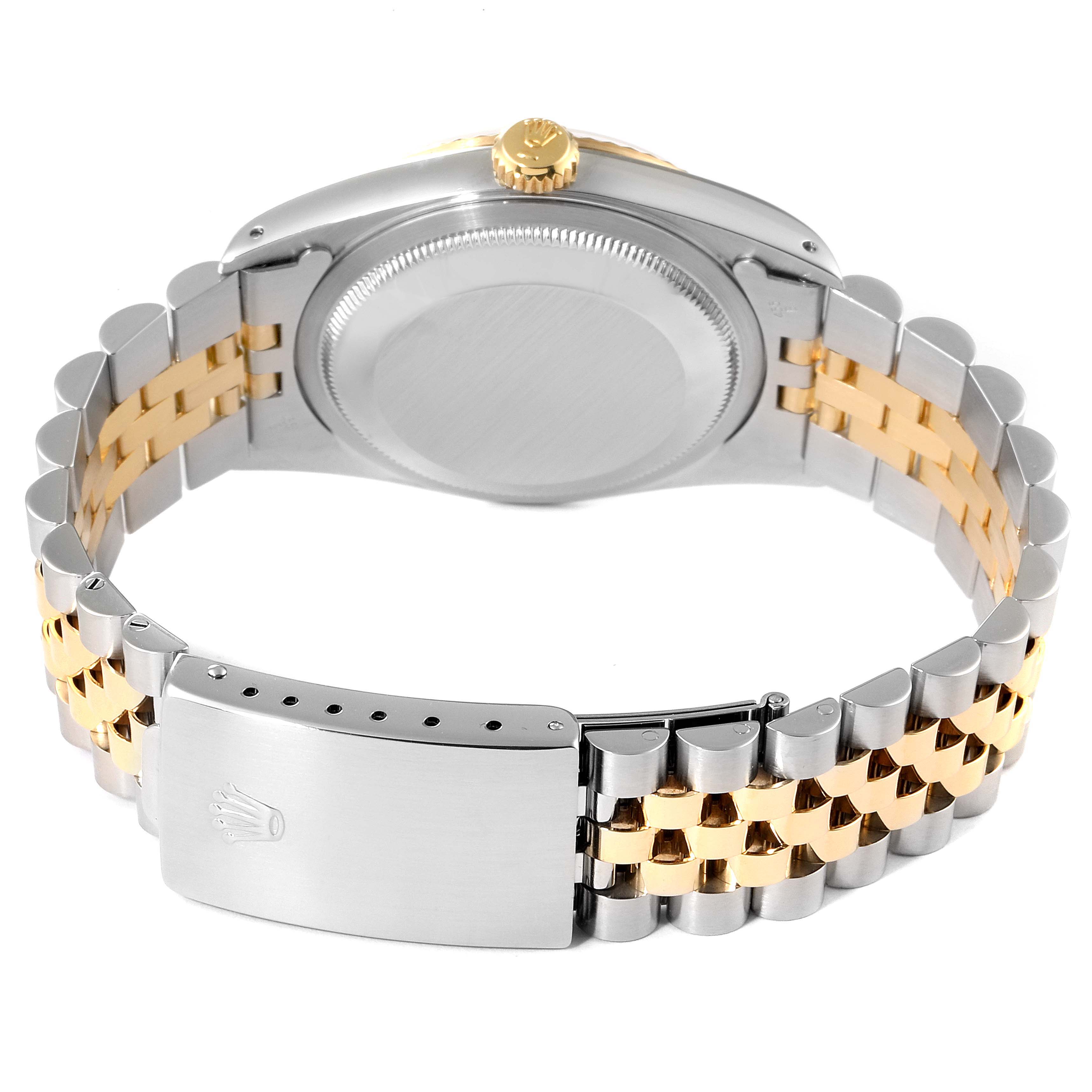 The image shows the back view of a Rolex Datejust 16233 Men's Steel and Gold (two tone) White Dial 16233 Men's Steel and Gold (two tone) White Dial watch, highlighting the case, crown, and two-tone bracelet with clasp.