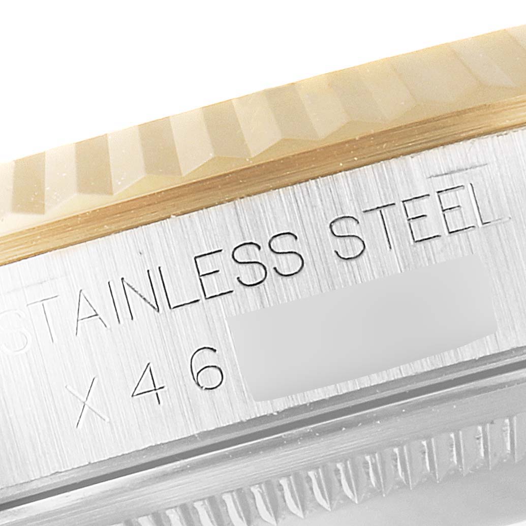 The image shows a close-up of the side of the stainless steel Rolex Datejust 16233 Men's Steel and Gold (two tone) White Dial 16233 Men's Steel and Gold (two tone) White Dial watch, highlighting its fluted bezel.