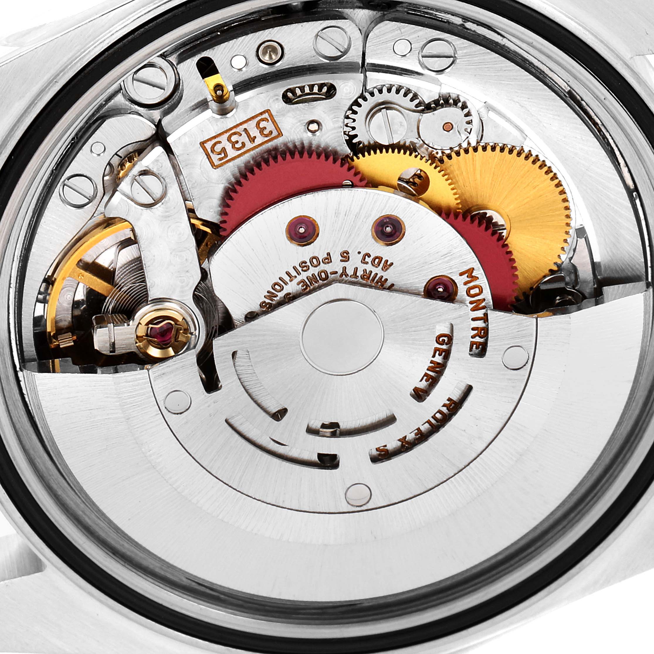 The image shows the intricate internal mechanism of a Rolex Datejust 16233 Men's Steel and Gold (two tone) White Dial 16233 Men's Steel and Gold (two tone) White Dial watch from a top-down angle.
