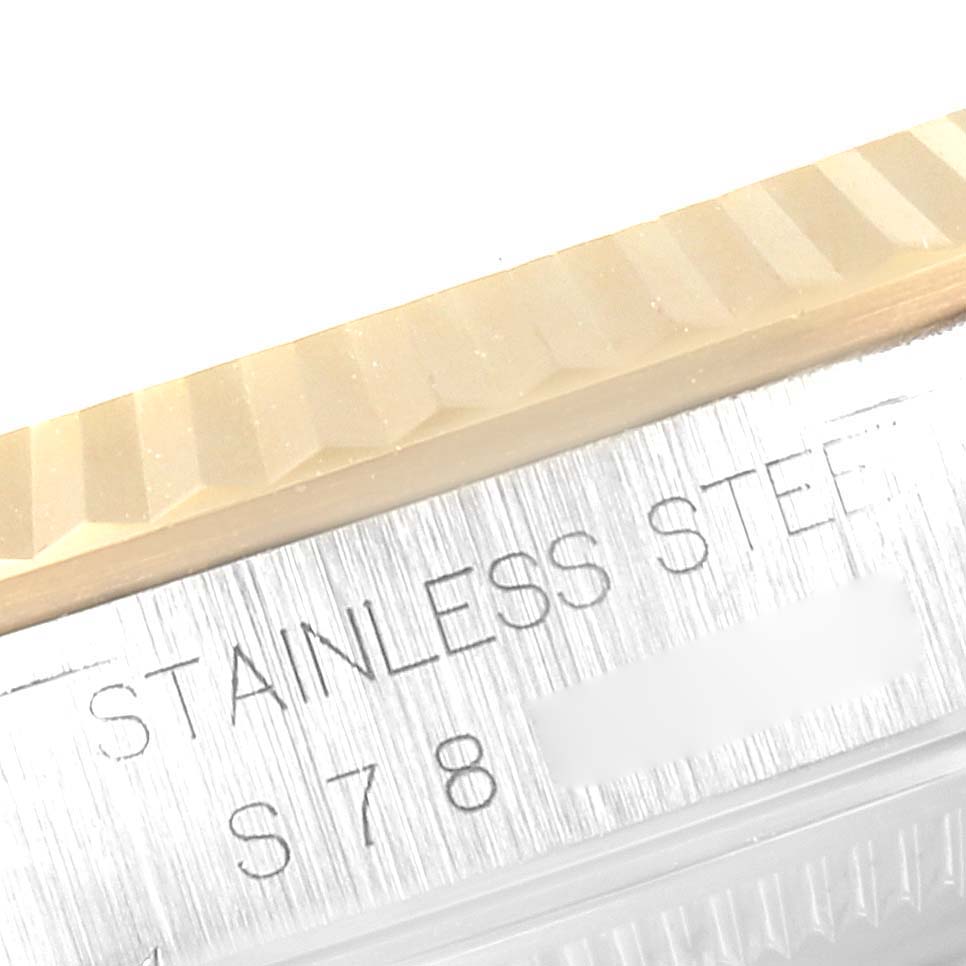 The image shows a close-up angle of the stainless steel case and fluted bezel of a Rolex Datejust 16233 Men's Steel and Gold (two tone) White Dial 16233 Men's Steel and Gold (two tone) White Dial watch.