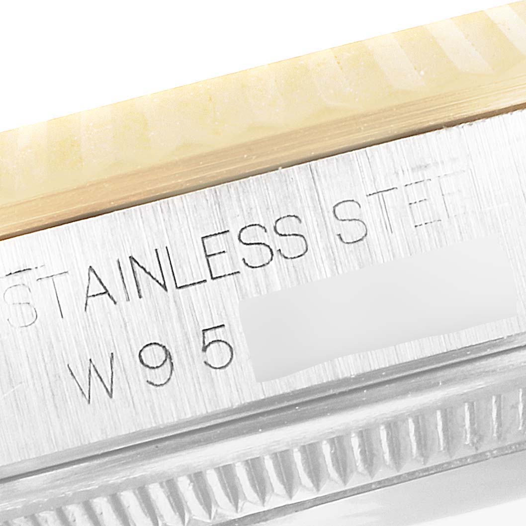 The image shows a close-up angle of the Rolex Datejust 16233 Men's Steel and Gold (two tone) White Dial 16233 Men's Steel and Gold (two tone) White Dial model, focusing on the engraved bezel and part of the case.