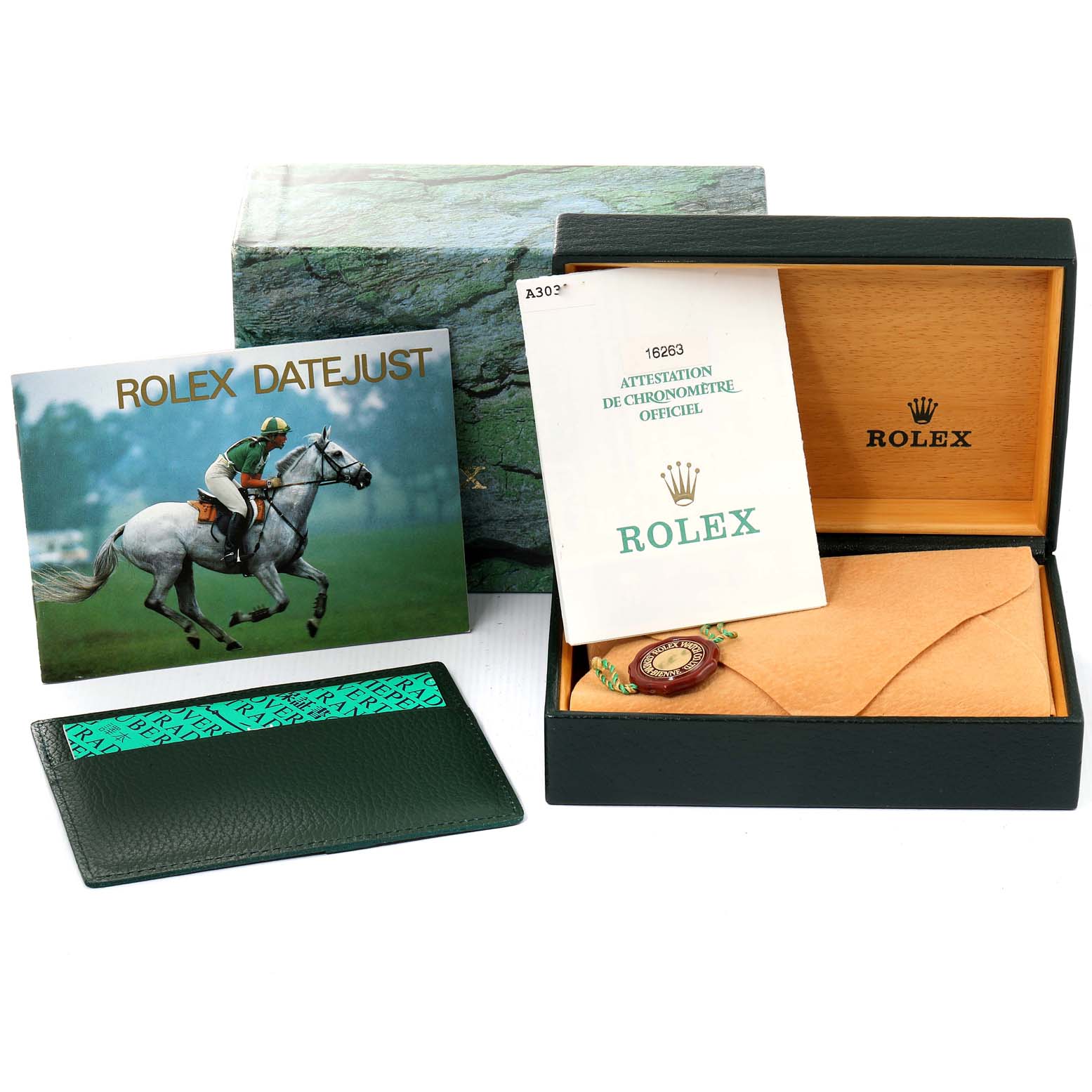 The image shows the accessories for a Rolex Turn-o-Graph 16263 Men
s Steel and Gold (two tone) White Dial 16263 Men
s Steel and Gold (two tone) White Dial model, including a warranty paper, box, booklet, and cardholder.