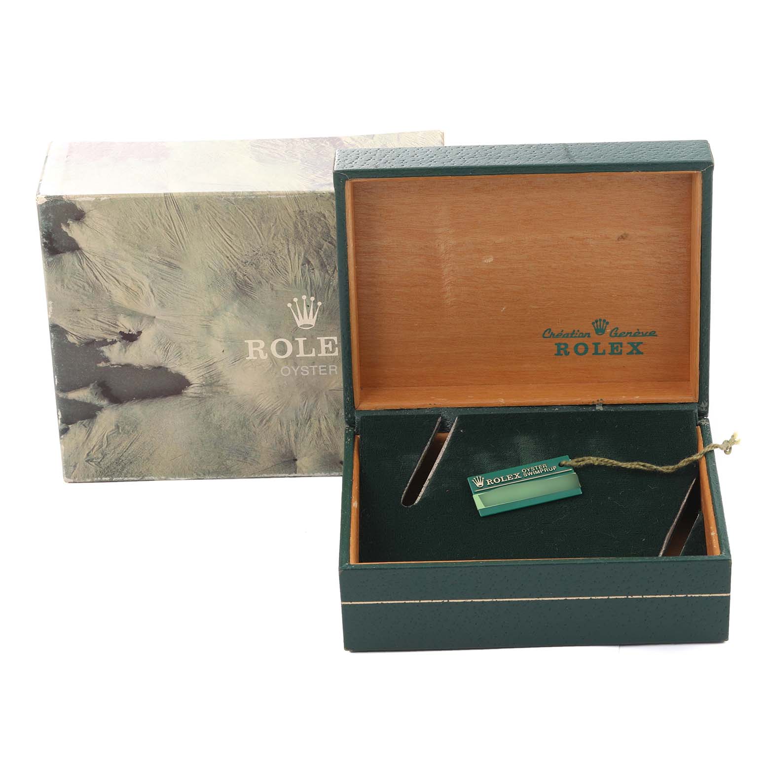 This image shows an empty green Rolex Datejust 16233 Men's Steel and Gold (two tone) White Dial 16233 Men's Steel and Gold (two tone) White Dial watch box and its tag from a slightly high angle.