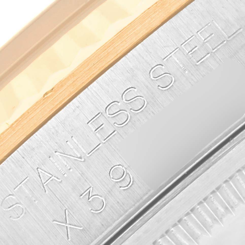 This image shows a close-up angle of the Rolex Datejust 16233 Men's Steel and Gold (two tone) White Dial 16233 Men's Steel and Gold (two tone) White Dial watch's stainless steel casing, focusing on its engraved markings.