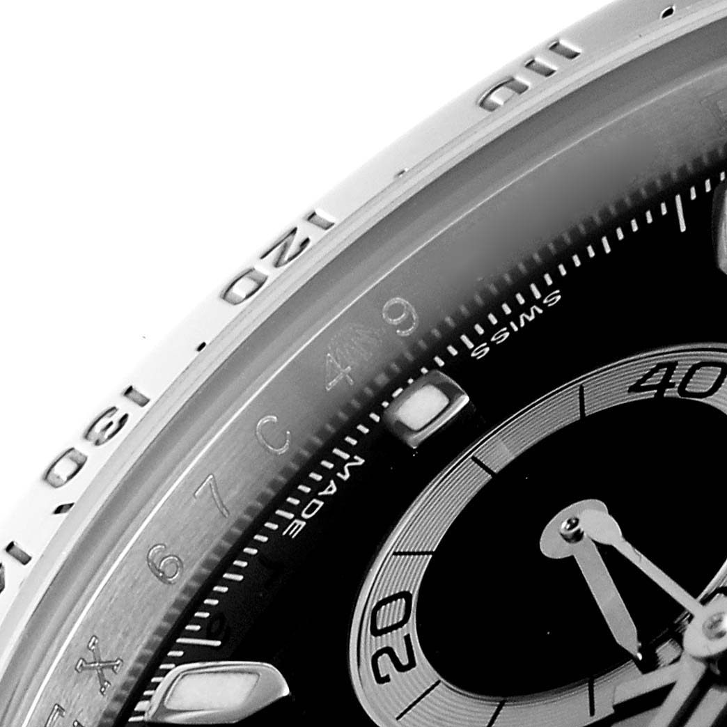This close-up image of a Rolex Daytona 116520 Men
s Stainless Steel Black Dial 116520 Men
s Stainless Steel Black Dial watch shows a portion of the bezel and part of the dial with its sub-dials.