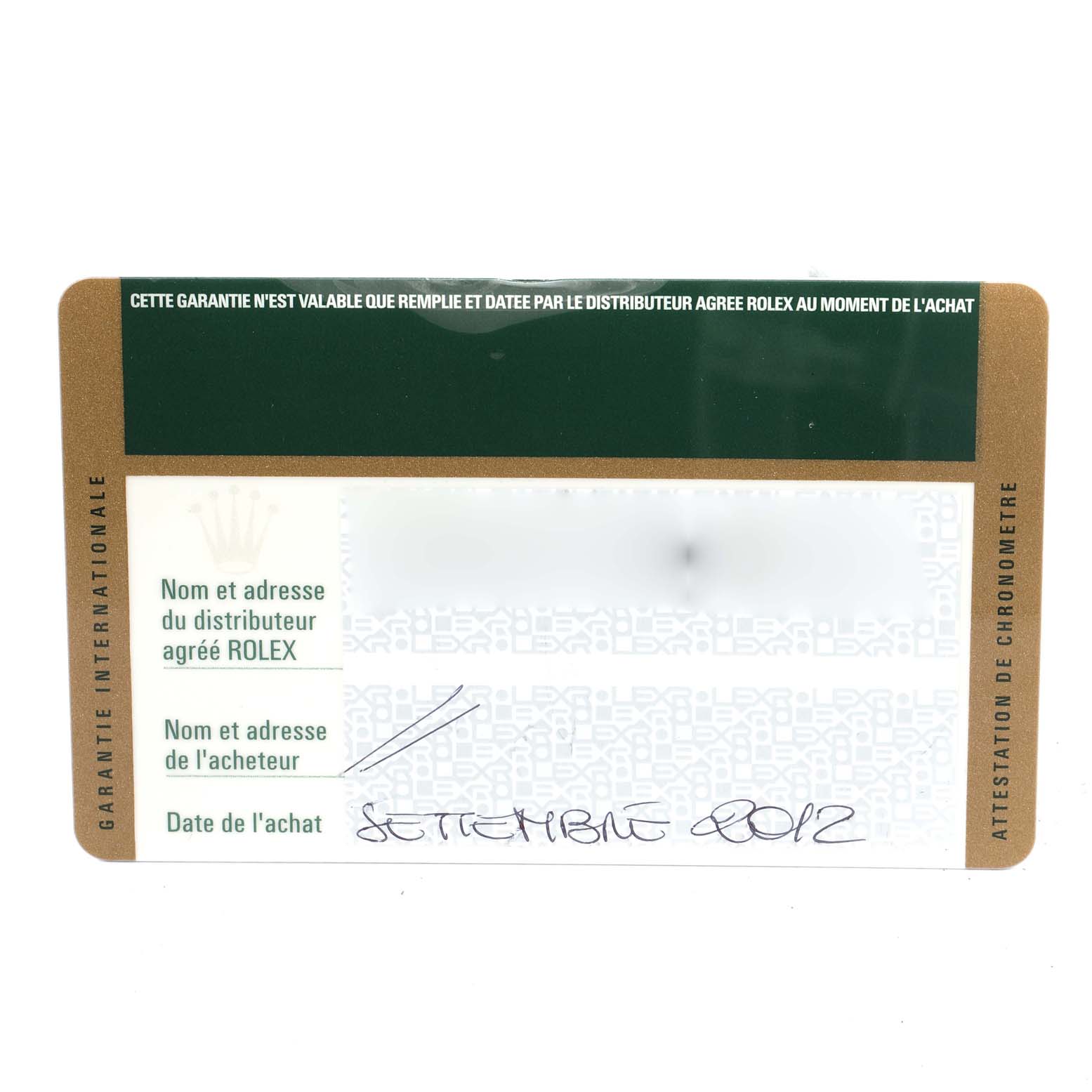 This image shows a warranty card for the Rolex Daytona 116520 Men
s Stainless Steel Black Dial 116520 Men
s Stainless Steel Black Dial watch, featuring fields for distributor and purchaser information, and a purchase date.