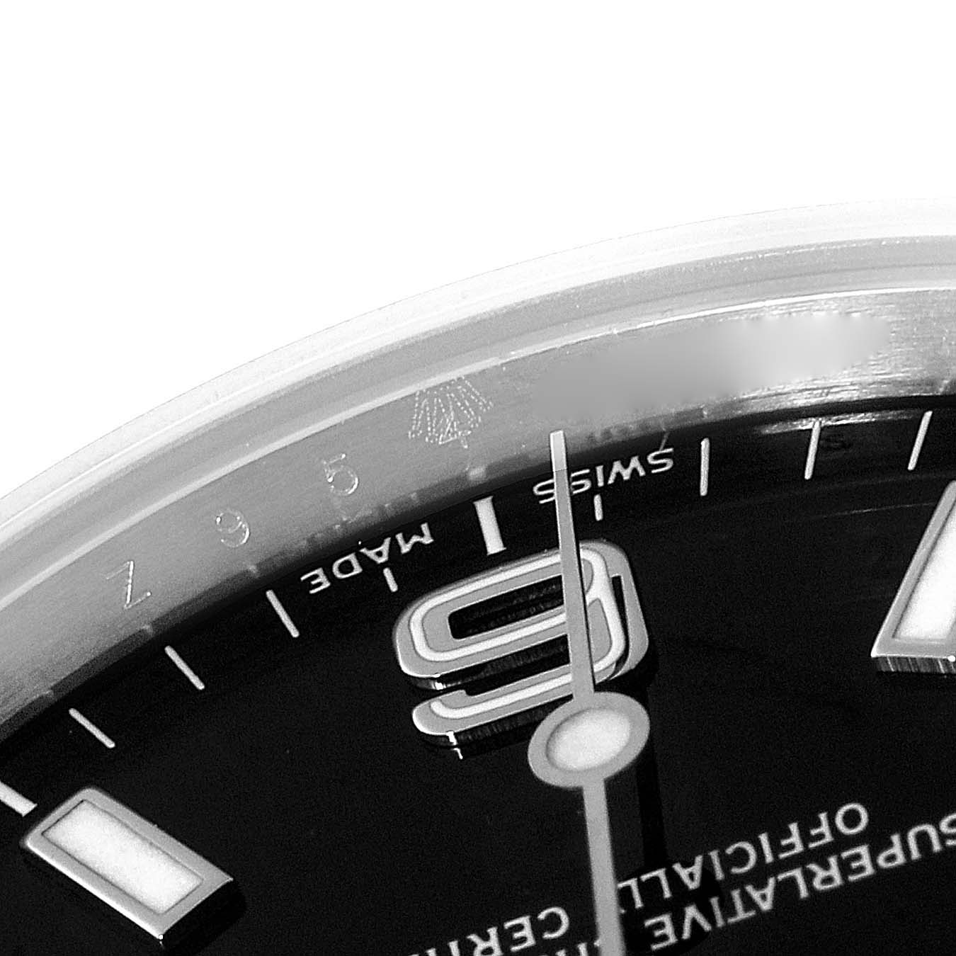 This close-up angle shows the upper part of the dial and the edge of the bezel on a Rolex Explorer 114270 Men's Stainless Steel Black Dial 114270 Men's Stainless Steel Black Dial watch.