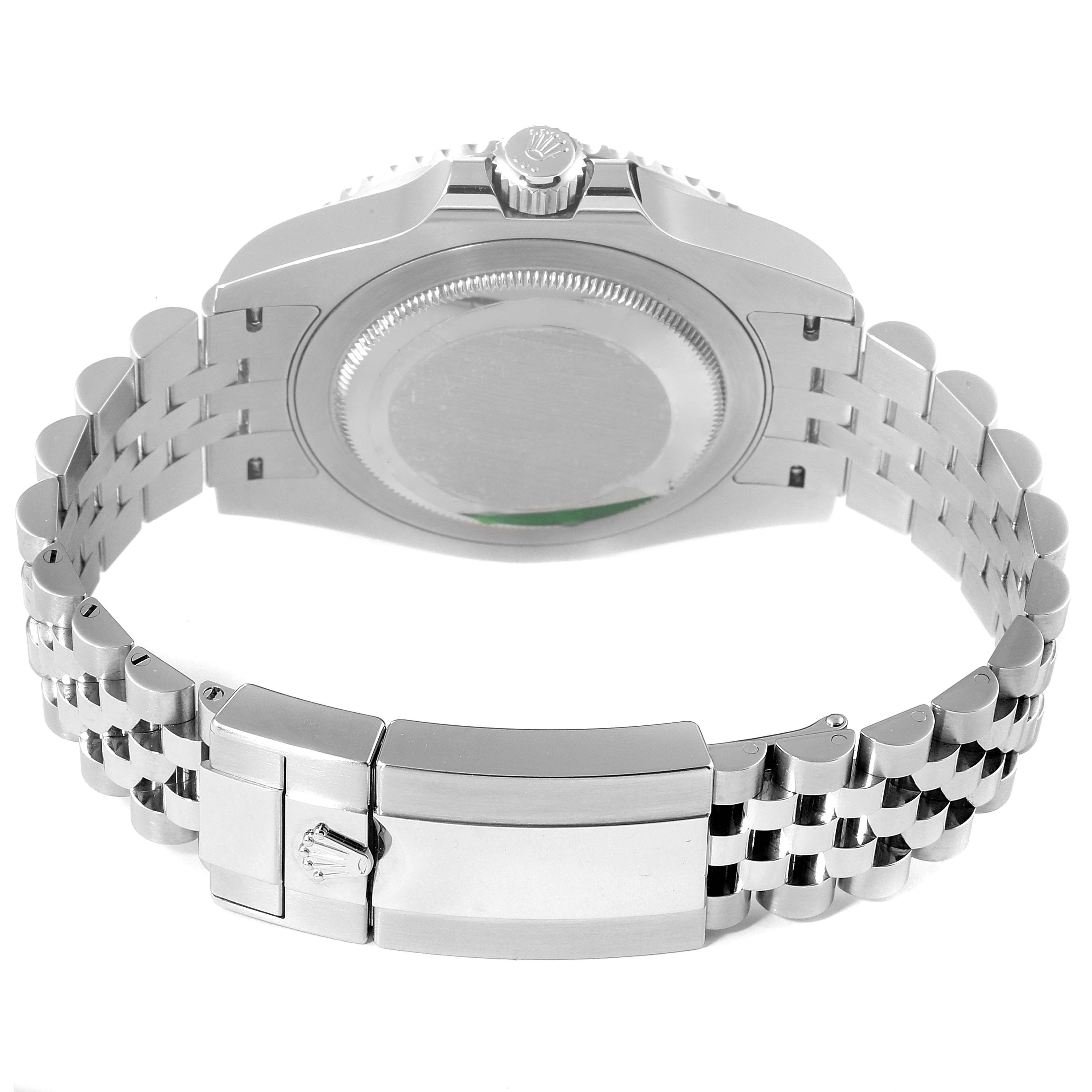 The image shows the underside and bracelet clasp of a Rolex GMT-Master 126710 Men
s Stainless Steel Black Dial 126710 Men
s Stainless Steel Black Dial watch, highlighting the case back and the Jubilee bracelet.