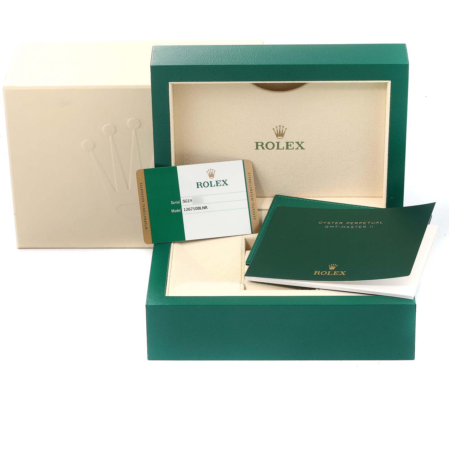 The image shows packaging and accessories for a Rolex GMT-Master 126710 Men
s Stainless Steel Black Dial 126710 Men
s Stainless Steel Black Dial, including the box, warranty card, and manuals.