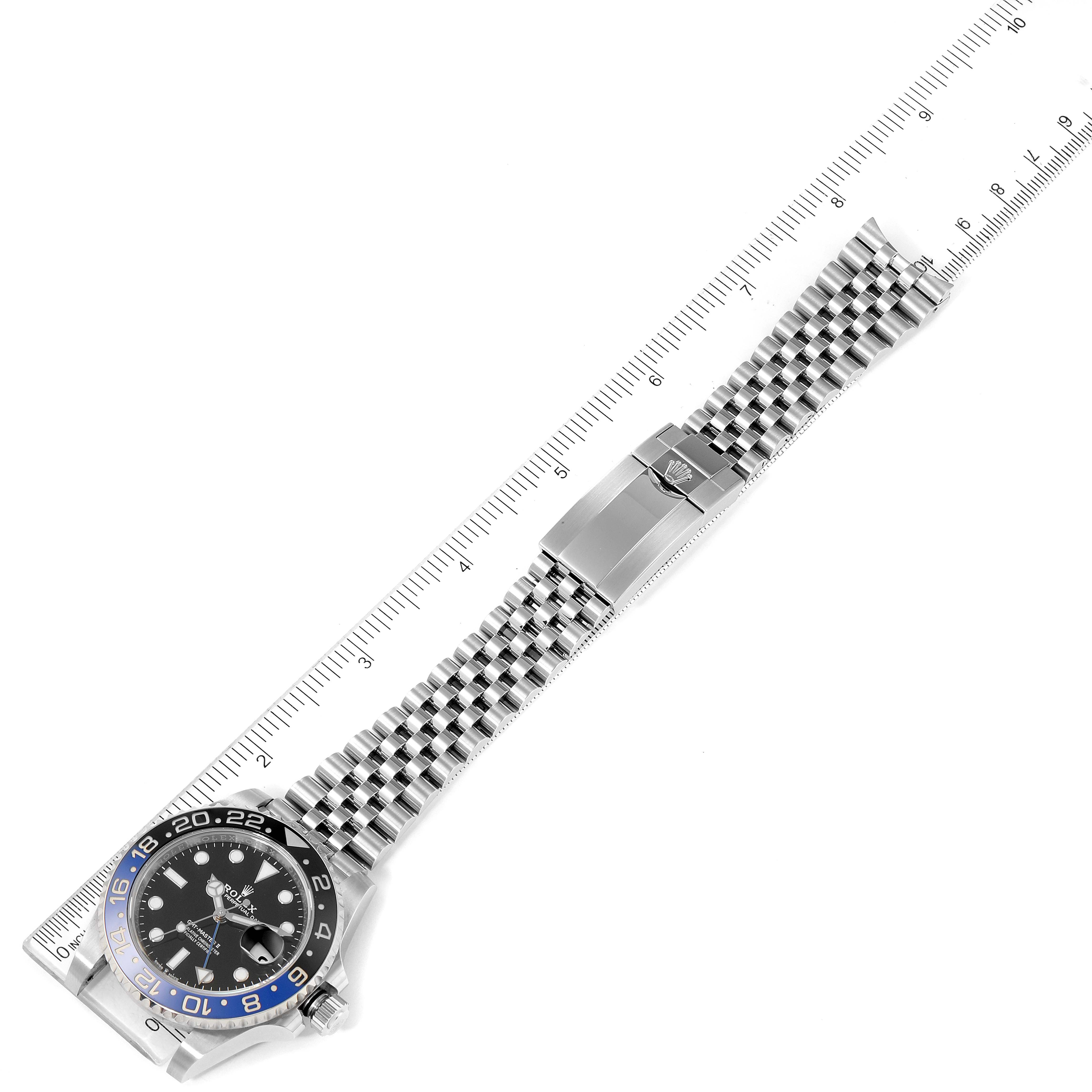 The image shows an overhead view of a Rolex GMT-Master 126710 Men
s Stainless Steel Black Dial 126710 Men
s Stainless Steel Black Dial watch, displaying the face, bezel, and full bracelet with a clasp.