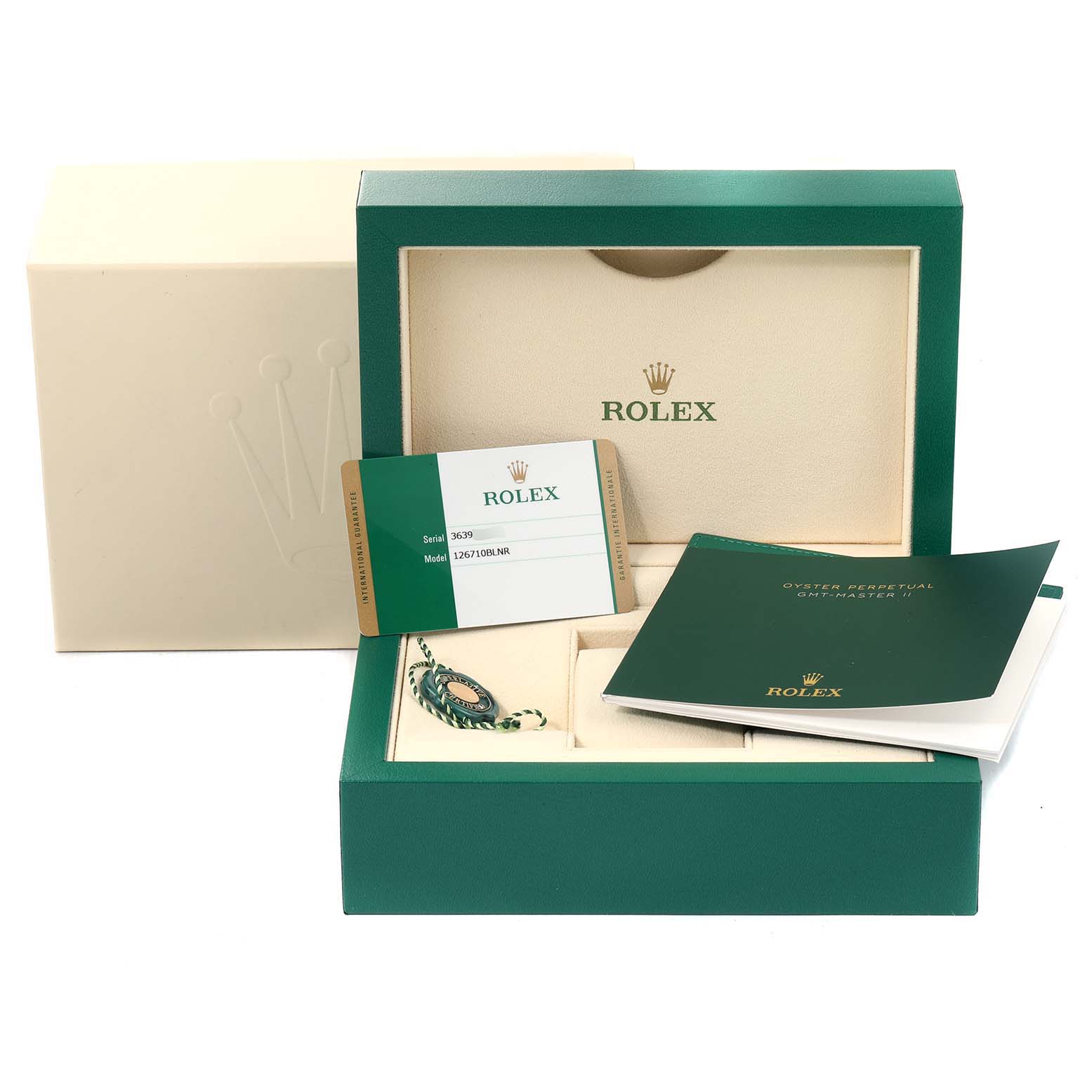 This image shows the packaging, warranty card, tags, and manual for a Rolex GMT-Master 126710 Men's Stainless Steel Black Dial 126710 Men's Stainless Steel Black Dial watch.