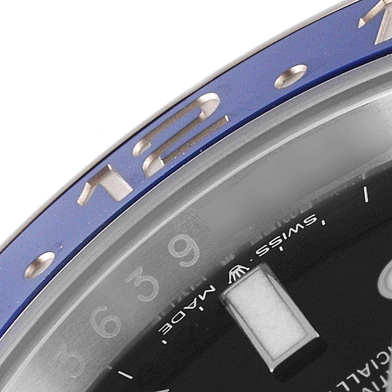 This image shows a close-up angle of the bezel and dial of the Rolex GMT-Master 126710 Men's Stainless Steel Black Dial 126710 Men's Stainless Steel Black Dial watch.