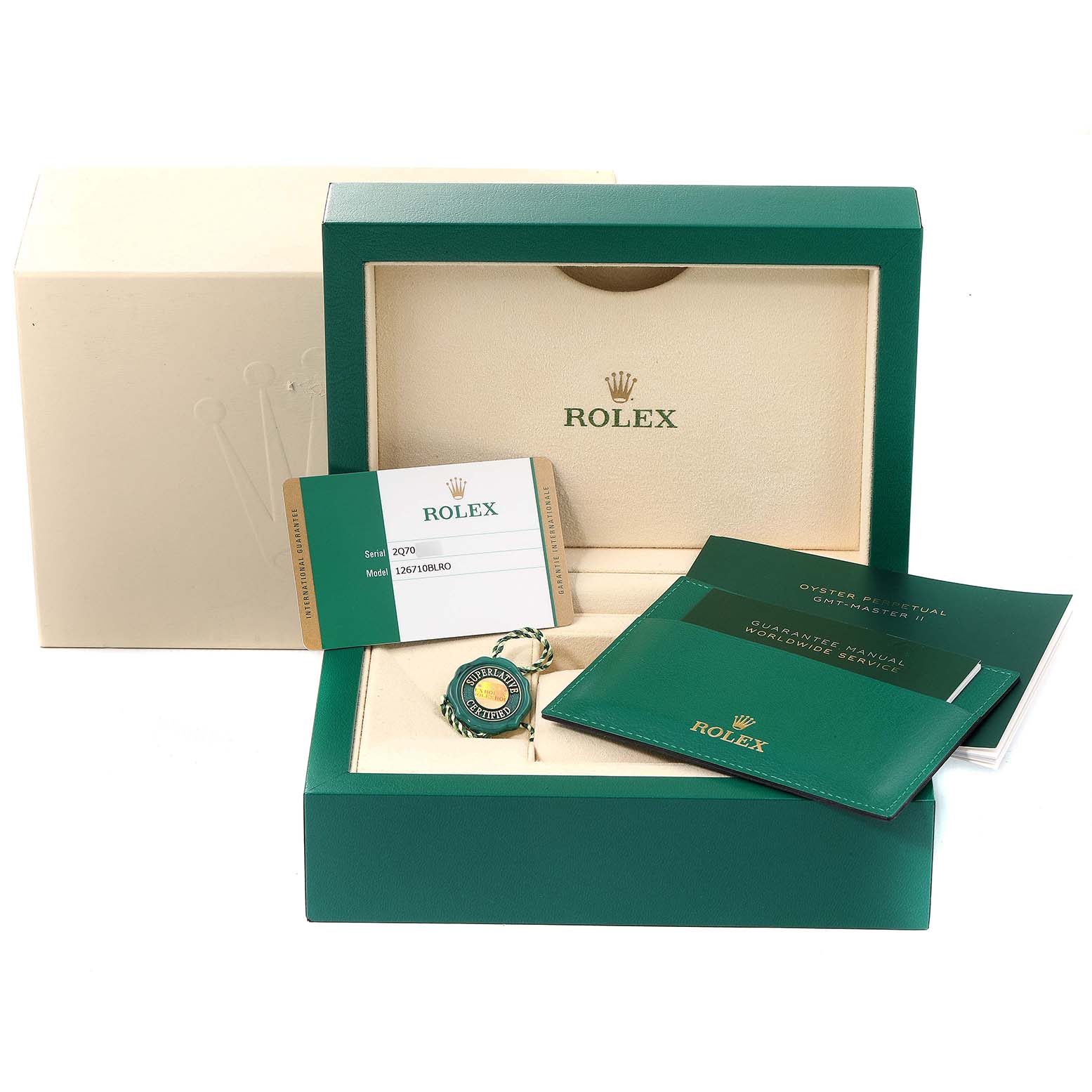 The image shows the accessories of a Rolex GMT-Master 126710 Men
s Stainless Steel Black Dial 126710 Men
s Stainless Steel Black Dial, including the box, guarantee manual, card, and tag.